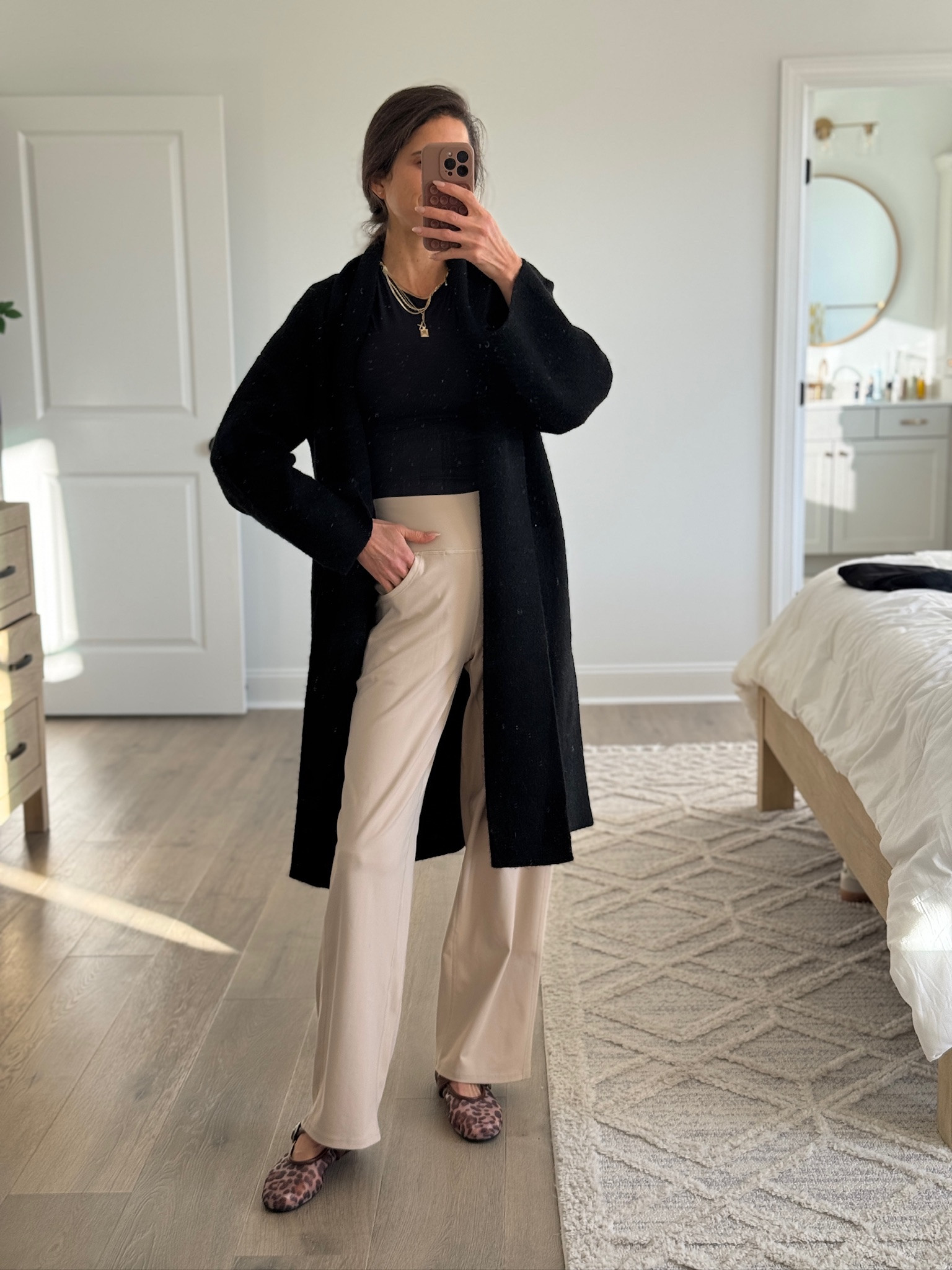 Easy neutral outfit I’ll wear on repeat. I love pairing a soft black cardigan with a fitted black top and high-waisted wide leg pants for a look that feels comfortable but still pulled together. This is one of those outfits that works for everyday errands, casual meetings, travel days, or a simple dinner out. Neutral pieces like these mix and match effortlessly and are staples I reach for all season.

#LTKmomlife #LTKootd #LTKSeasonal