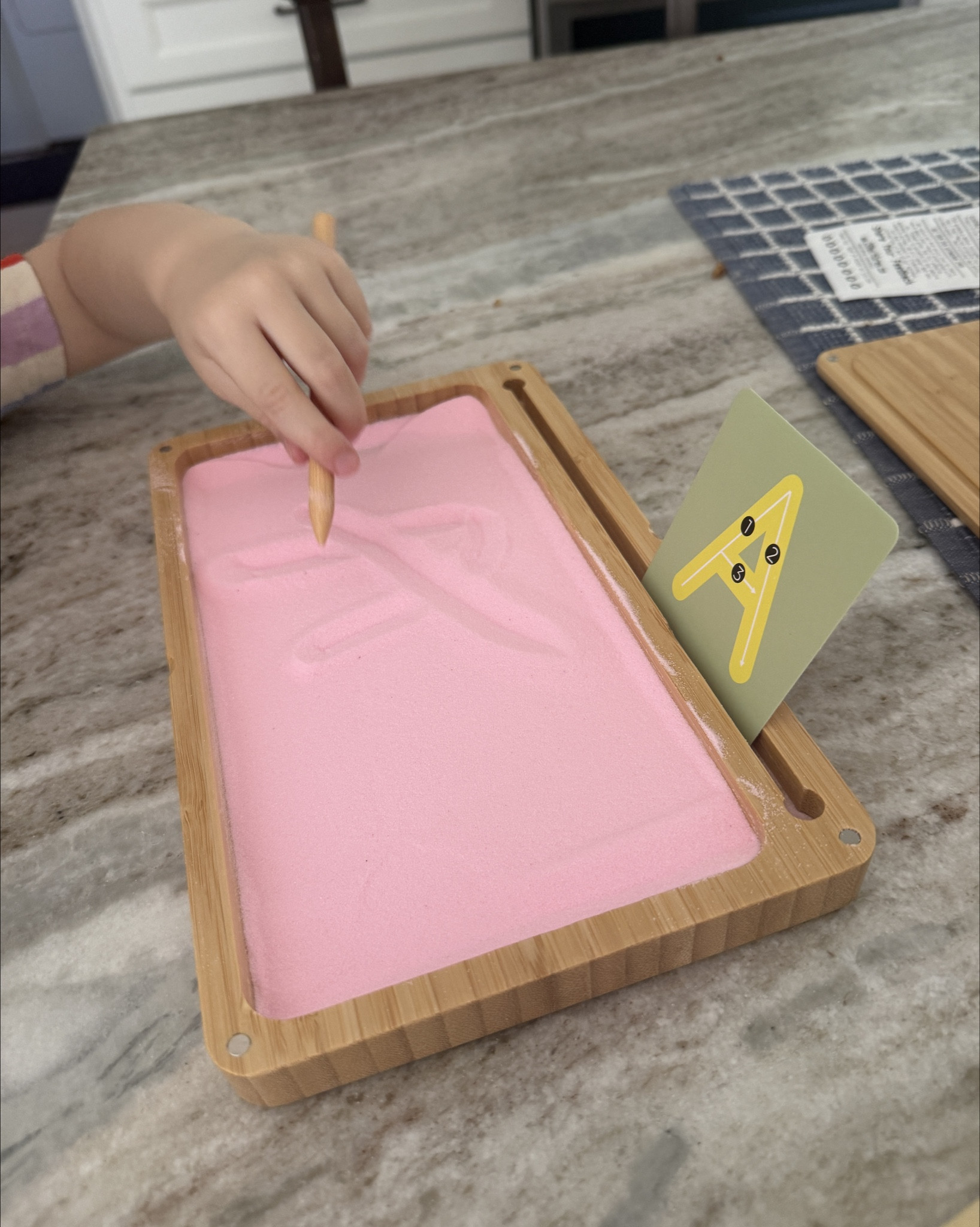 Working in our letter sounds and writing them with this sand box! She’s a bit young for this right now but it’s a fun way to start learning.

#LTKdayinmylife #LTKKids #LTKTravel