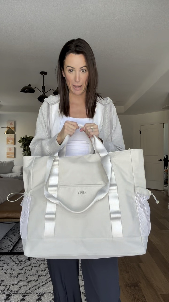 Another favorite thing I got for the sale is this massive bag that is going to be my go to when we travel to Hawaii next month! It has a handle to carry by hand, shoulder handles, and has a spot to slip on your luggage! It also comes in black, but I love this white! On sale during the YPB sale, 30% off plus and extra 20% off with code YPBAF.

#LTKtravel #LTKsalealert #LTKfindsunder100
