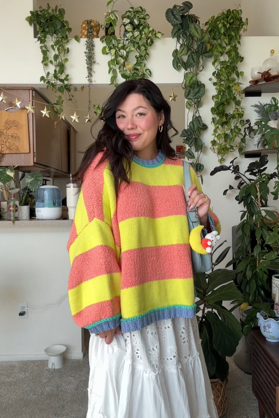 Size L in sweater, skirt is from tj maxx, purse is coach, keychain from hellodiscountstore