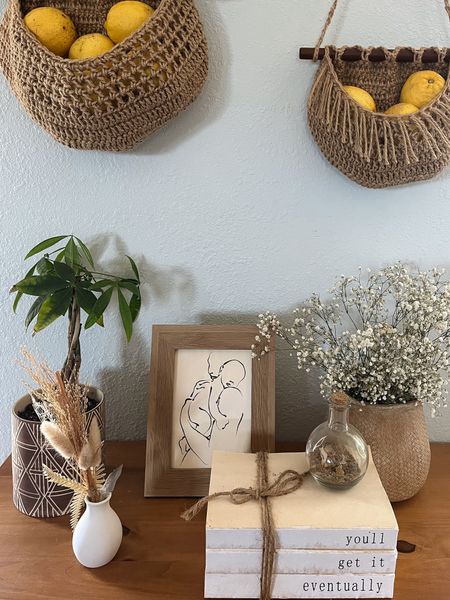 A corner of our California boho living room 🥰

Desert vibes, cozy living room ideas, macrame wall baskets, neutral boho vibes, indoor plants decor, boho chic home accents, eclectic furniture picks

#LTKfamily #LTKfindsunder100 #LTKhome