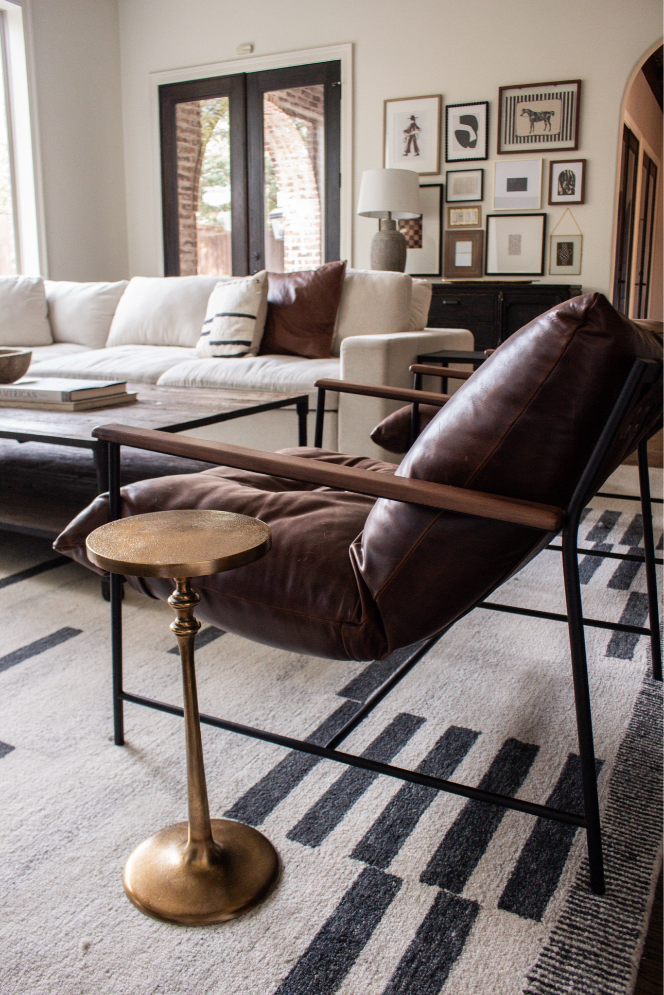 Current home decor obsession: warm neutrals, dark wood accents, oversized lamps, and gallery walls that feel collected over time. This entire space is home goals.

#LTKSeasonal #LTKHome