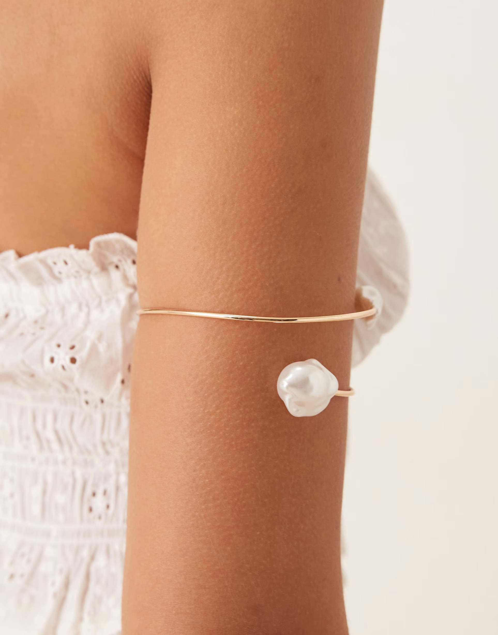 ASOS DESIGN wrap around arm cuff with molten faux pearls in gold tone | ASOS (Global)