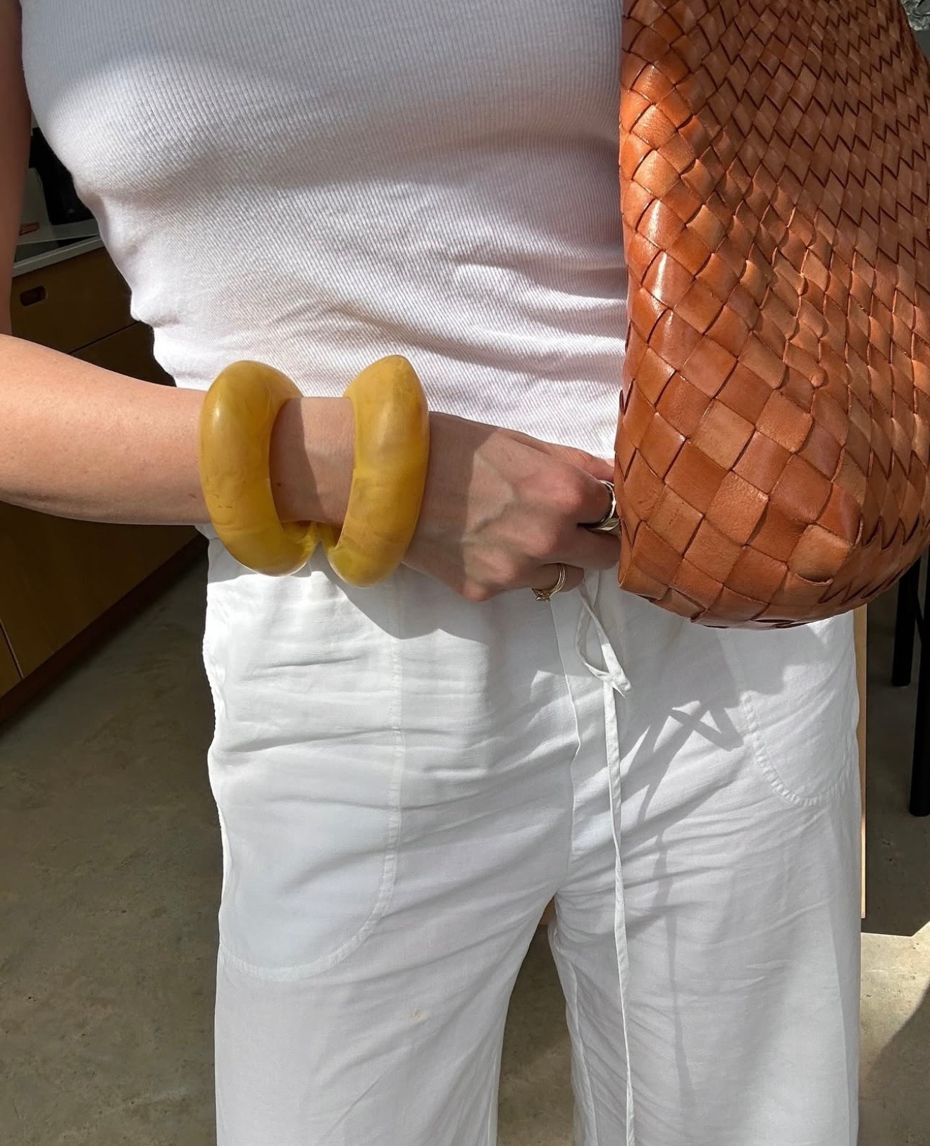 As your outfits get smaller and your ability to layer lessens, accessories do the heavy lifting. This yellow bangle adds just the right hit of colour and character to an all white simple summer look.

Read all about my summer style report for Net a Porter on my Substack.

#LTKsummer #LTKstyletip