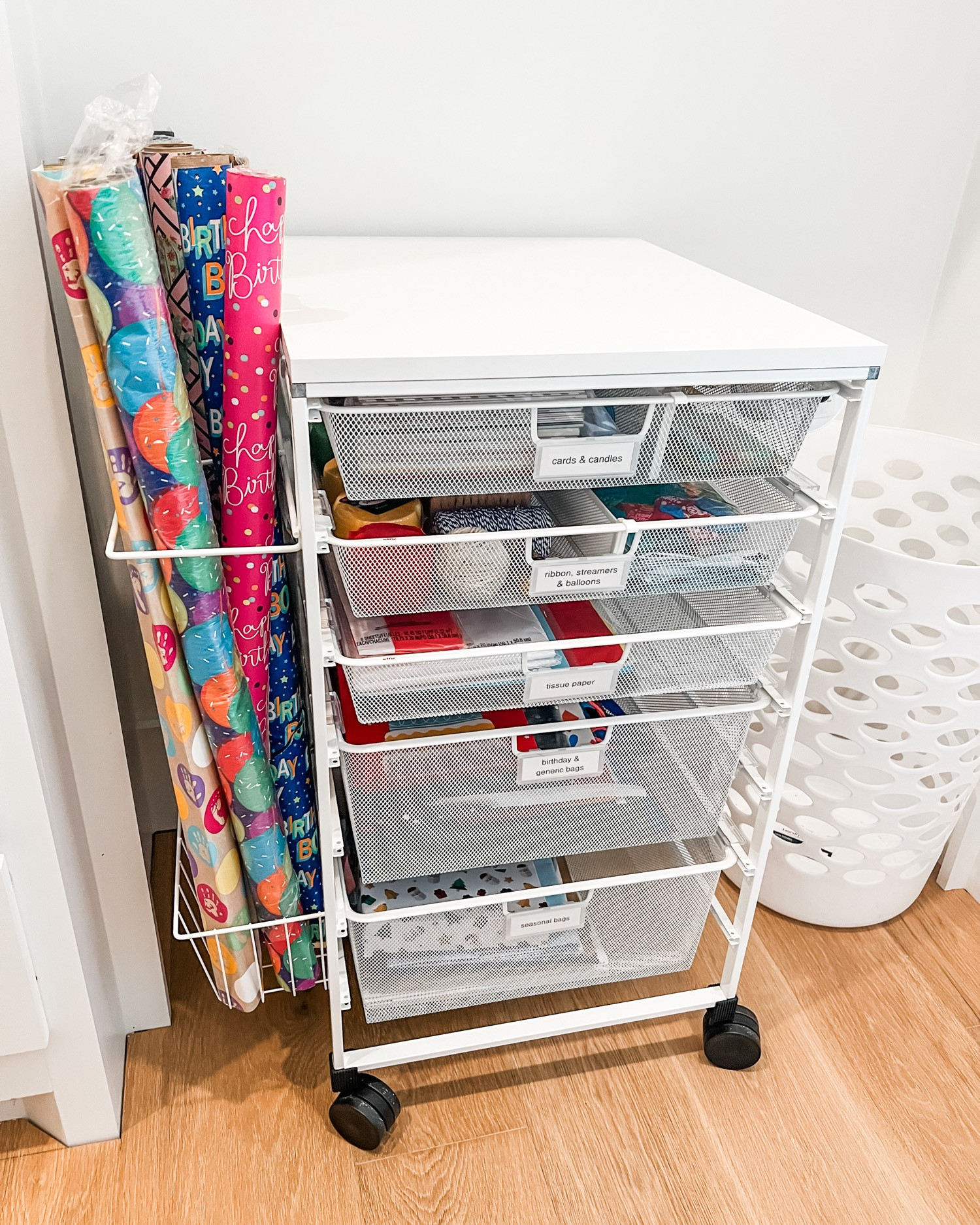 The functionality of the Elfa carts for organizing wrapping supplies is a hill we will die on. It's just the perfect solution for keeping everything together in one place. Plus, it's got wheels so you can move it around to the space where you want to do your wrapping! 🎁

We'd love to come put this together for you! DM us. 

 
