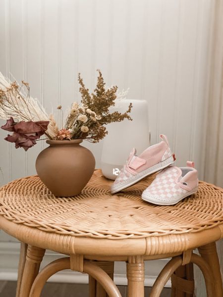 Side table in the nursery! Hatch sound machine, cute vans and a little floral vase. Simple way to decorate a nursery! Baby girl nursery ideas, vans, shoes for babies 

#LTKhome #LTKbaby #LTKfamily