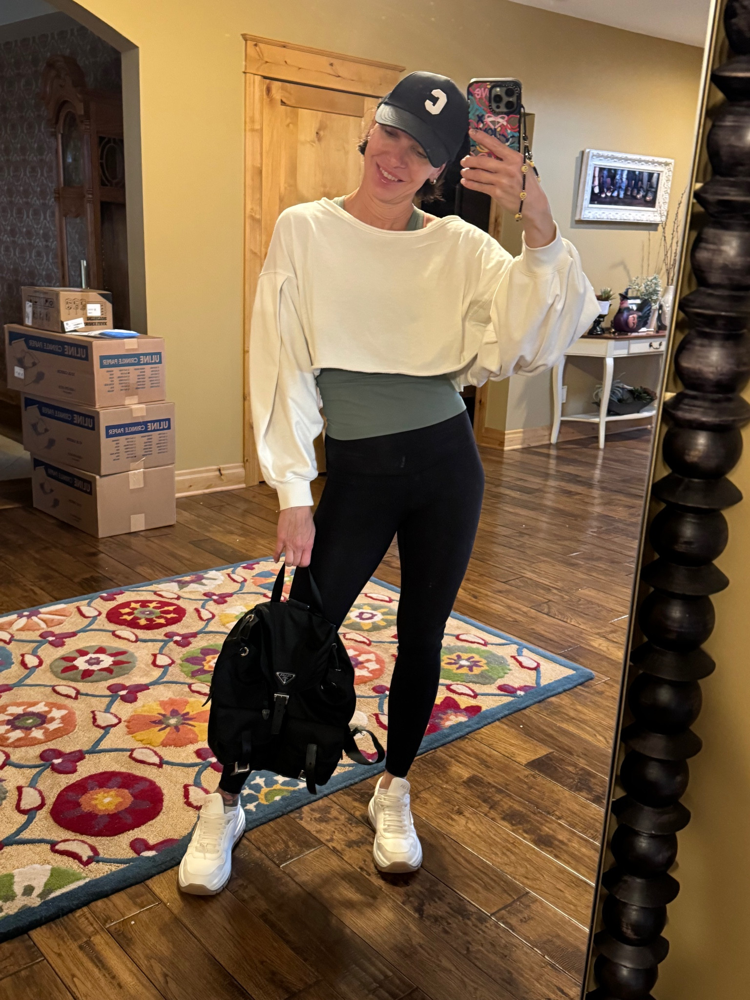 Fall casual active outfit. 
Lululemon leggings 
Like a cloud sports bra 
Lululemon tank top 
Free People pull over 
Prada sneakers 
Prada backpack 
Celine hats 

#LTKActive #LTKSeasonal #LTKStyleTip