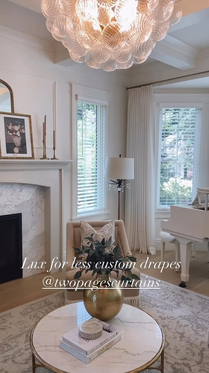 Love these custom curtains. Comes in tons of colors and sizes. These are Liz Ivory white pinch pleat. 