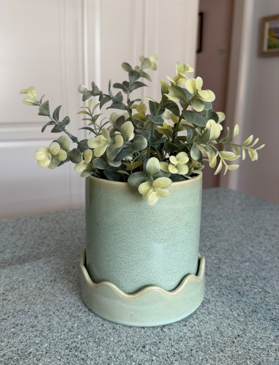 Finally found the perfect pot for my faux plant. It’s in a plain white plastic pot. I wanted to zhuzh it up. The scalloped planter has drainage holes for live plants too! 

#LTKHome