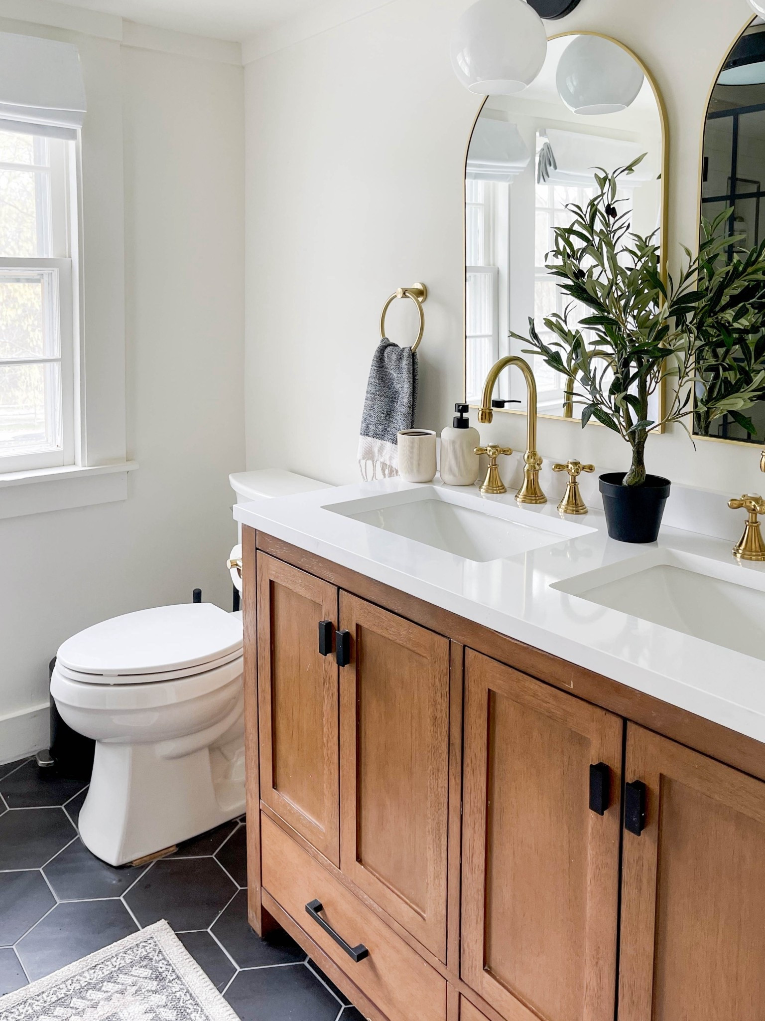Vanity wood paired with brass fixtures and simple finishes in this bathroom. Linked exact and similar pieces below. #bathroomdesign #neutralhome

#LTKSaleAlert #LTKHome