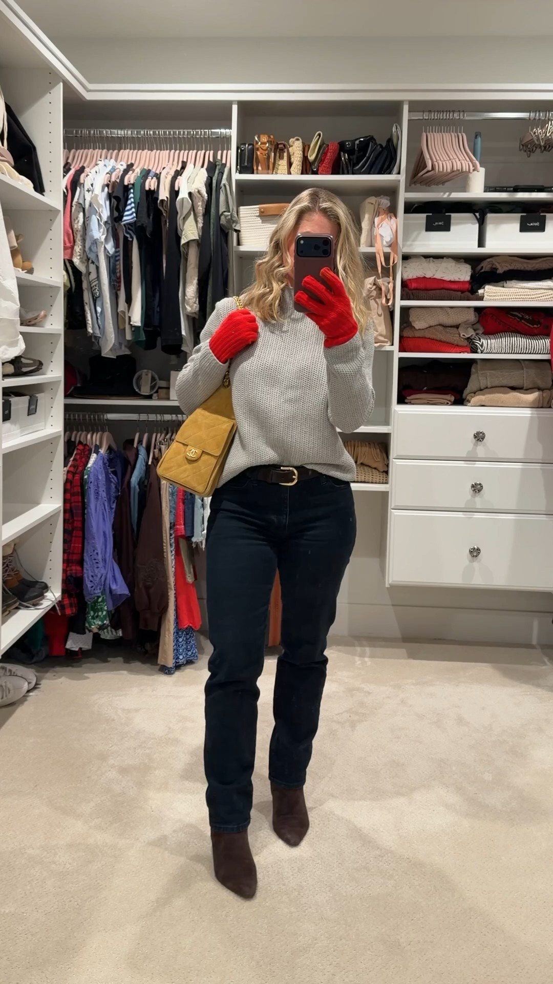 Inspired by the latest Chanel runway in NYC with its cozy sweaters, rich textures, and bold pops of color. I recreated the vibe with a soft gray knit, dark denim, chocolate suede boots, and that perfect hit of red in the gloves. Finished it with my vintage yellow Chanel to echo the show’s elevated everyday styling.

It’s that effortless mix of practical winter layers and luxe touches that Chanel does so well. 🤍🖤✨

#LTKSeasonal #LTKootd #LTKGiftGuide
