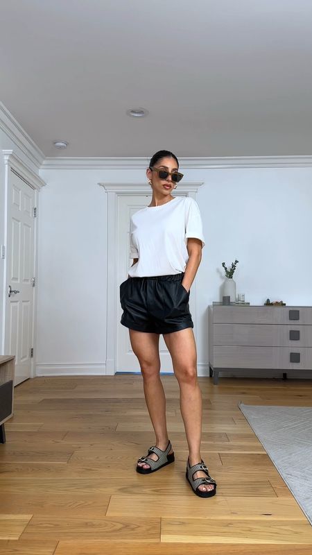 Easy summer outfit, black shorts and oversized t shirt. The leather adds the perfect amount of detail with added texture. #summershorts #shorts #revolve #leathershorts #sandals #chunkysandals 

#LTKStyleTip #LTKActive #LTKVideo