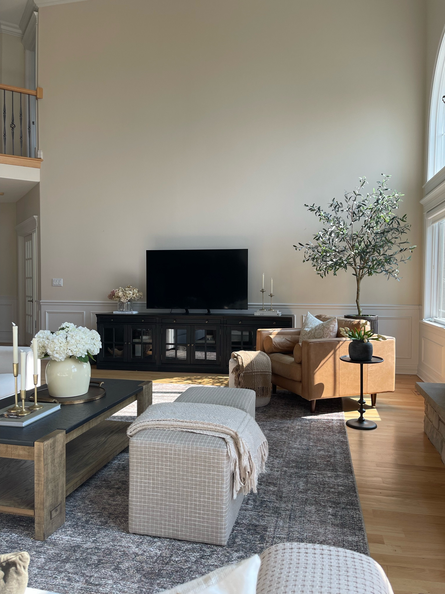 We have debated putting the tv on the wall and then we decided against it. I love our media cabinet - it’s 3 cabinets pushed together. 

Great room, media cabinet, living room, olive tree, indoor planter, chair, accent chair, ottoman, cube, rug, side table, tulips, coffee table, hydrangea, home decor, vase, flowers, living room, 

#LTKunder100 #LTKhome #LTKFind