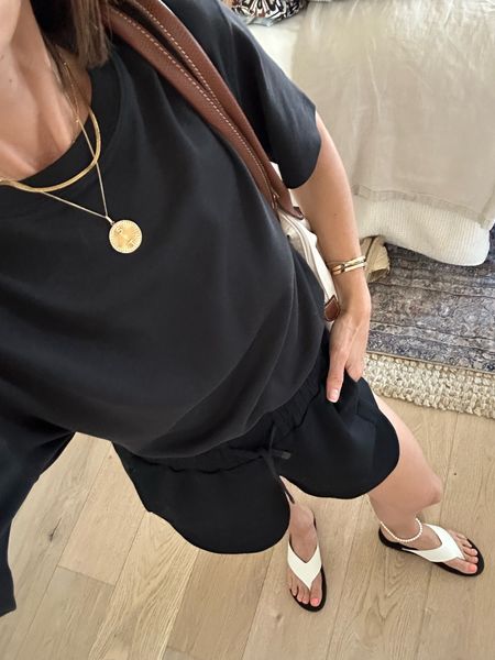 Today’s easy outfit for travel errands- pieces are from April’s capsule wardrobe 
Tee is oversized, wearing a 2xs 
Shorts are so soft run tts 
Sandals 10% off with code ITSYBITSYINDULGENCES10

#LTKover40