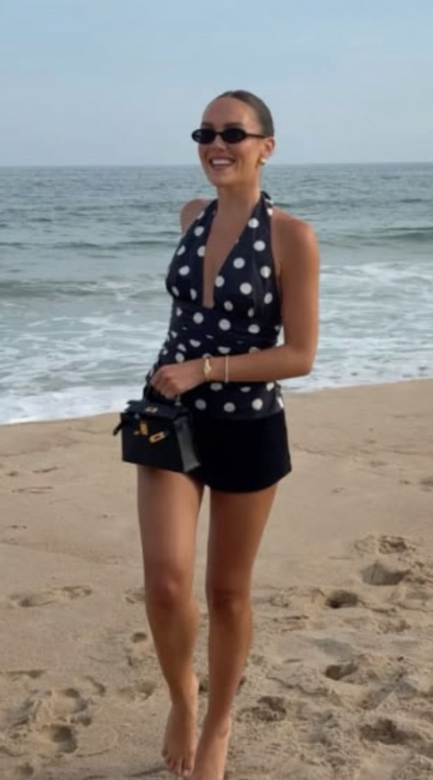 Polka dot vacation outfit inspiration 🤍 This retro-inspired beach look feels so timeless and chic with the halter top, black shorts, tiny sunglasses, and mini bag details. Perfect for a coastal dinner, resort vacation, or elevated beach day look 🌊✨ #beachstyle #vacationoutfit #polkadottrend #summerstyle #coastalchic #resortwear #europeansummerstyle #ltktravel #beachvacationoutfit 

 #LTKootd