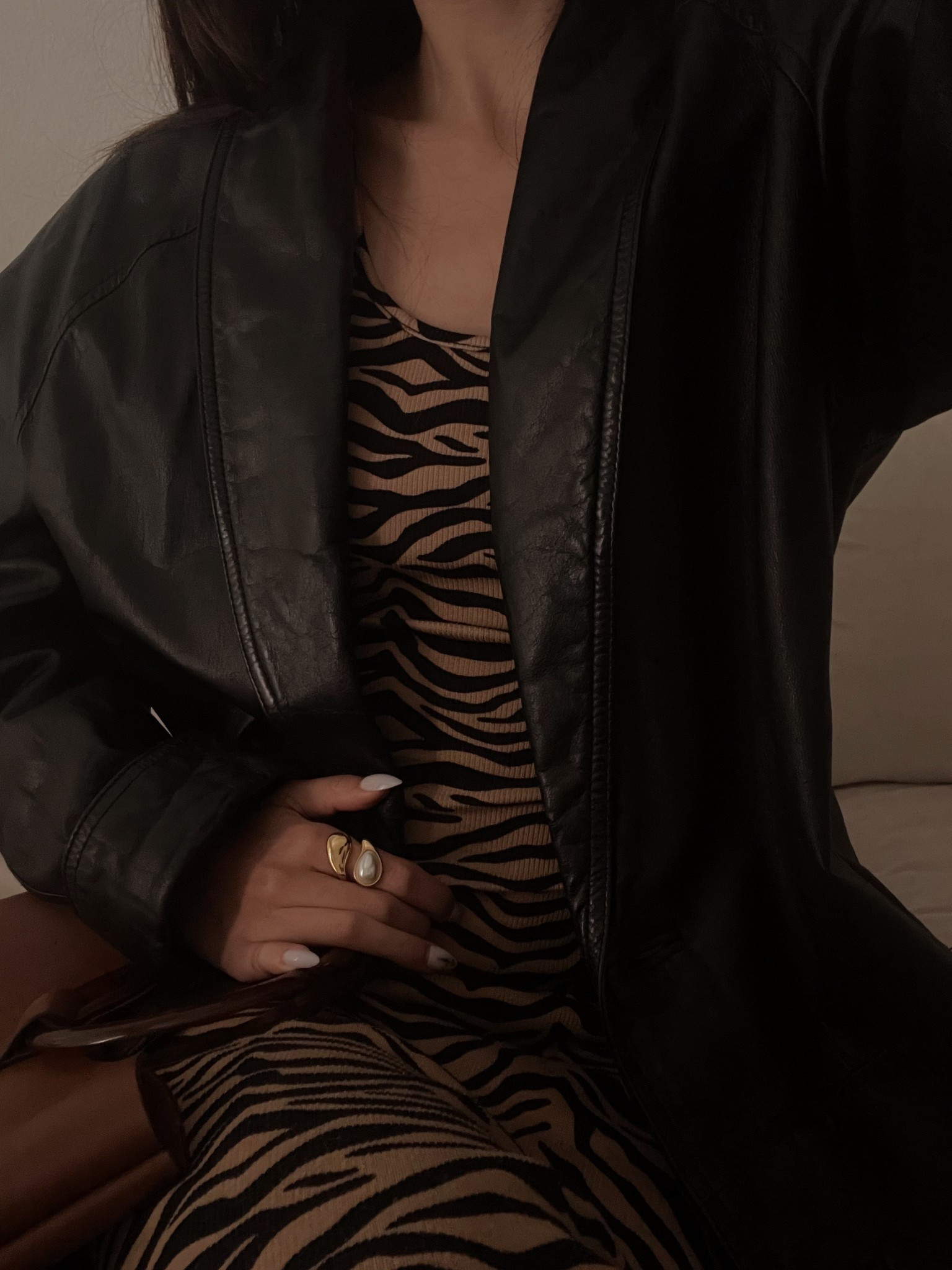 A black oversized leather coat is one of those forever wardrobe staples 🖤 

It instantly elevates any outfit, whether layered over an animal print dress for date night or styled with elevated basics for everyday wear.

I paired this classic leather jacket with a bold pearl statement ring to soften the edge and add a touch of modern femininity. The contrast of structured outerwear + gold and pearl jewelry will always be one of my favorite styling formulas.

If you’re building a fall/winter capsule wardrobe, a timeless leather coat and statement pearl jewelry are must-haves ✨

#LTKootd #LTKWorkwear #LTKSeasonal
