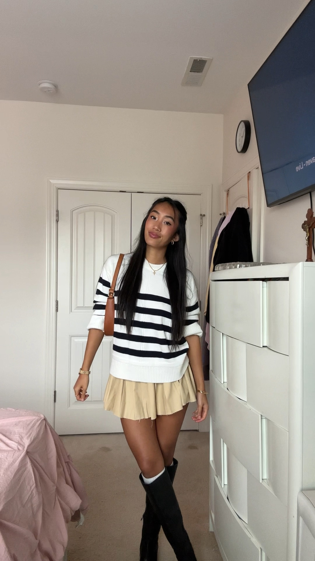 Fall outfit idea. Fall outfit combo. Striped sweater. Knee high boots. Fall sweater. Pleated skirt. Wearing a size small and 7.5 shoe!

#LTKSeasonal #LTKSaleAlert #LTKStyleTip