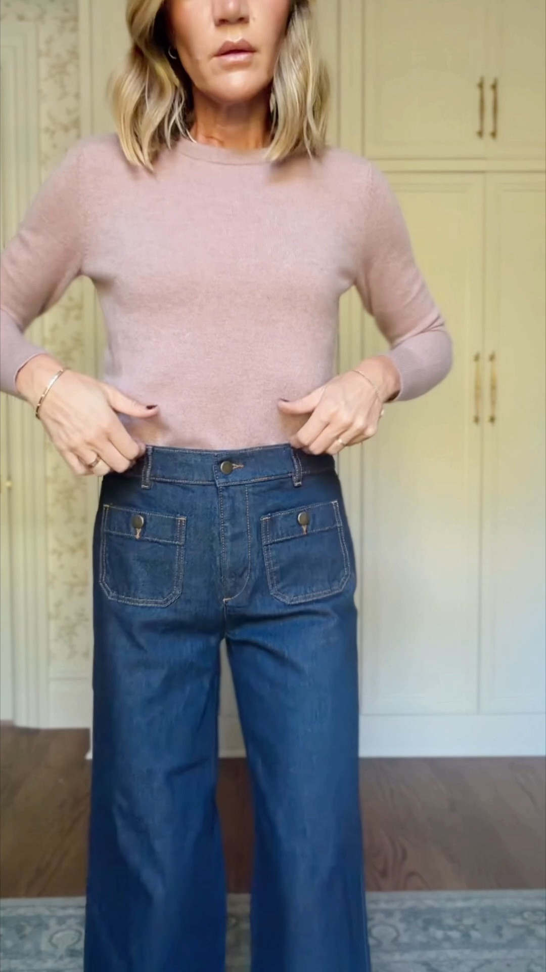 Xs in sweater 
0 in jeans 
S in trench