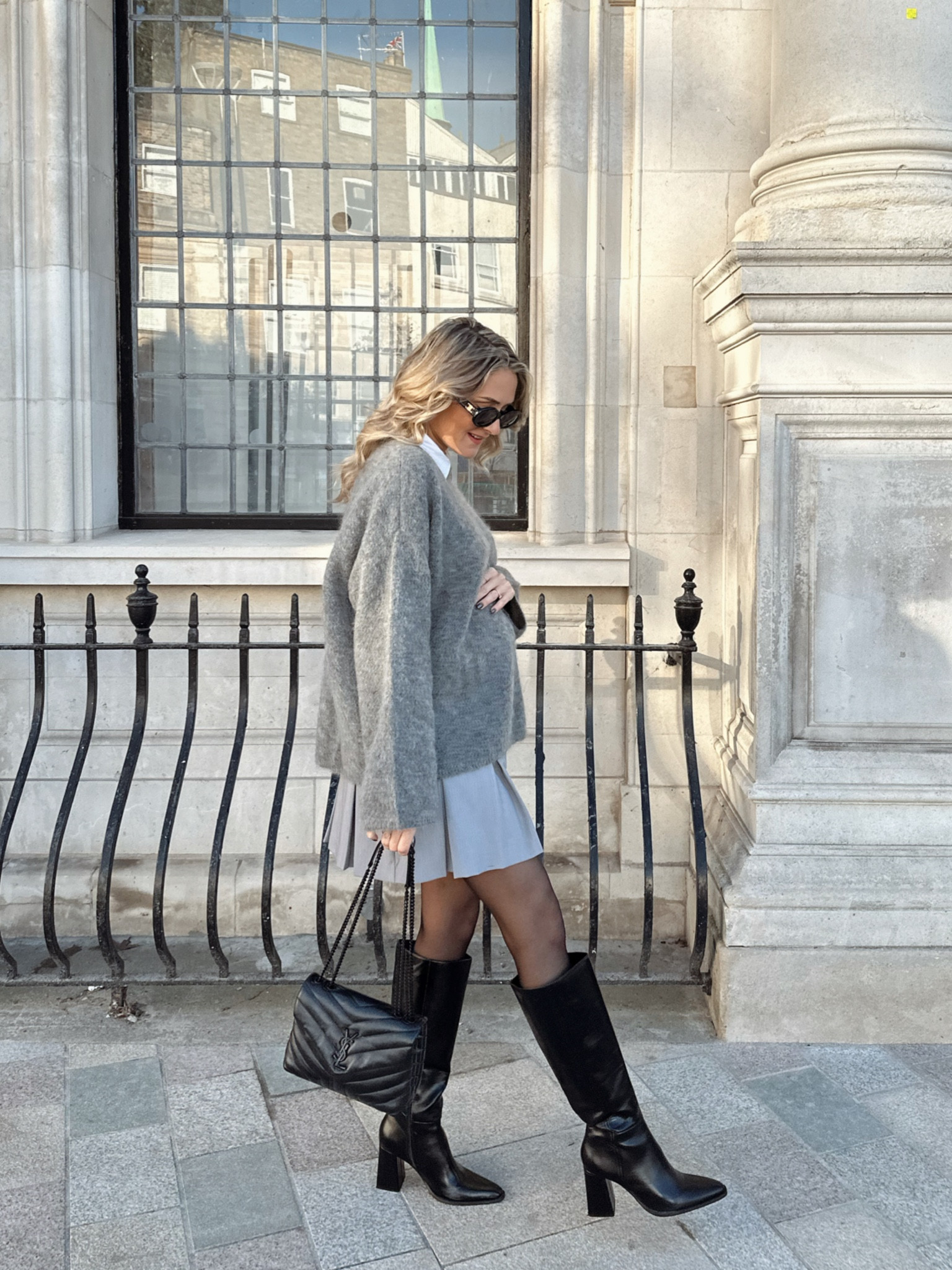 Grey outfit styling knee high boots, a mohair jumper, tights and a grey pleated skirt 

#LTKstyletip