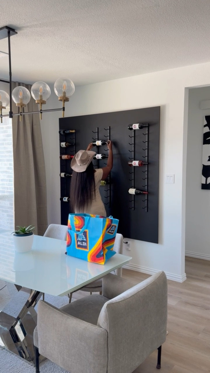 🍷✨ This project was so worth the weekend DIY effort! Started with basic plywood and 2x4s to create the foundation, then used wood filler to smooth out all the seams and imperfections (trust the process!). 

The secret to that ultra-luxe finish? Taking time with the filling and sanding before painting! I went with a rich matte black that makes the bottles POP against the wall. The floating effect creates such a statement piece - guests literally gasp when they walk in! 💁‍♀️

Wine storage that doubles as wall art? Yes please! This multifunctional piece transforms an ordinary wall into a conversation starter. Plus, having your favorite bottles displayed this way actually encourages you to use them instead of forgetting what you have!

Need help creating a custom statement piece that elevates YOUR space? I'd love to help transform your home into the sanctuary you deserve! Reach out to shinta@luxemodinteriors.com and let's create something perfectly tailored to your style and needs. Your dream space is just an email away! ✉️

#HomeDecor #WineStorage #DIYHomeProject #LuxeModInteriors #InteriorDesign #FloatingShelf #WineDisplay #HomeTransformation #StatementPiece #CustomDesign #HomeInspo​​​​​​​​​​​​​​​​

#LTKHome #LTKStyleTip #LTKFindsUnder100
