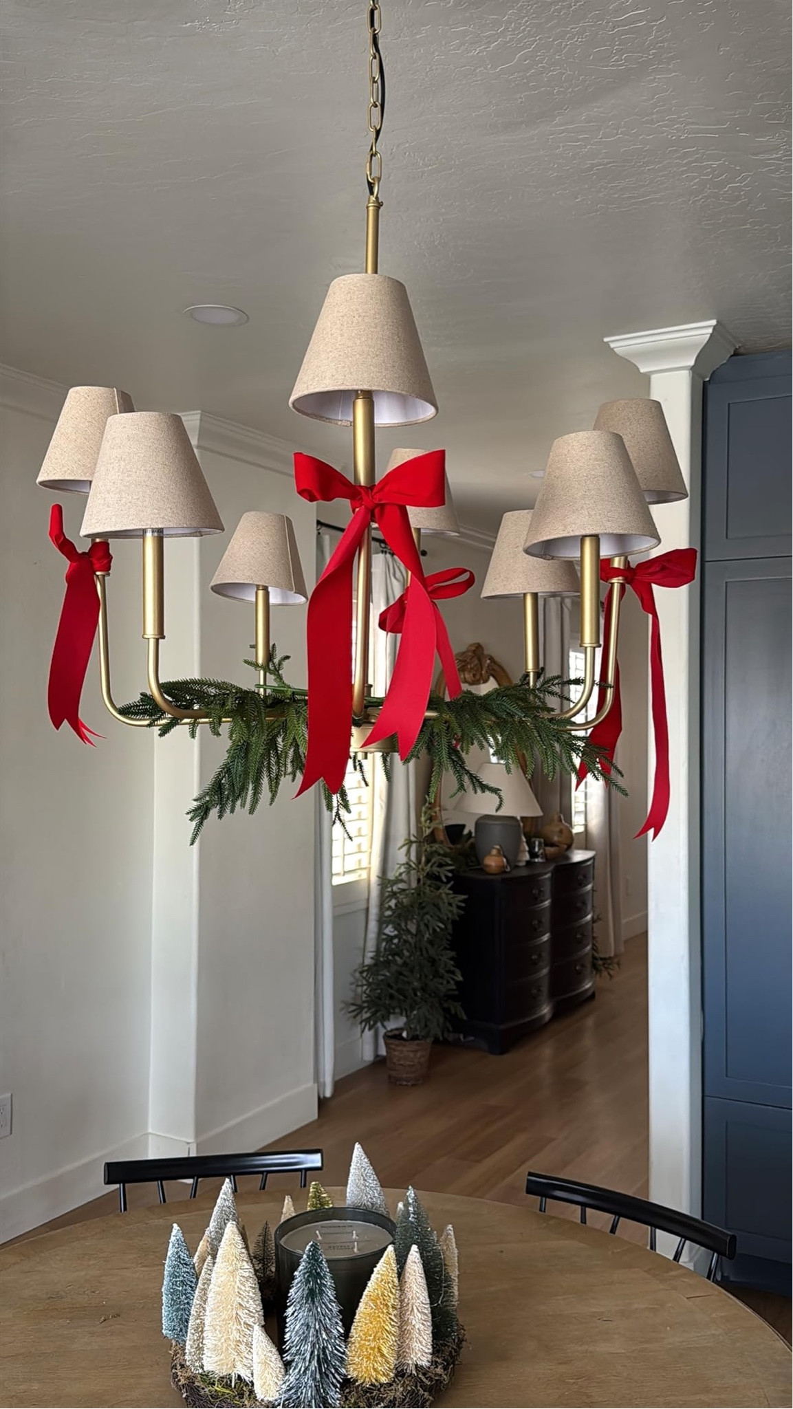 I'm loving our new chandelier makeover with a pop of red ribbon and greenery for Christmas! Perfect holiday glow.🎄✨

#LTKSeasonal #LTKHome #LTKHoliday