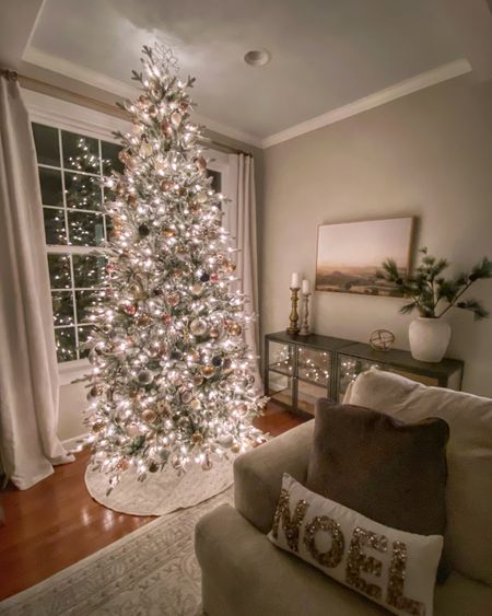 Neutral Christmas Tree
Color scheme = black, ivory, gold, silver, champagne, and rose gold. With a few little woodland creations mixed in for fun (owls, squirrels, etc)

#LTKSeasonal #LTKHoliday #LTKhome