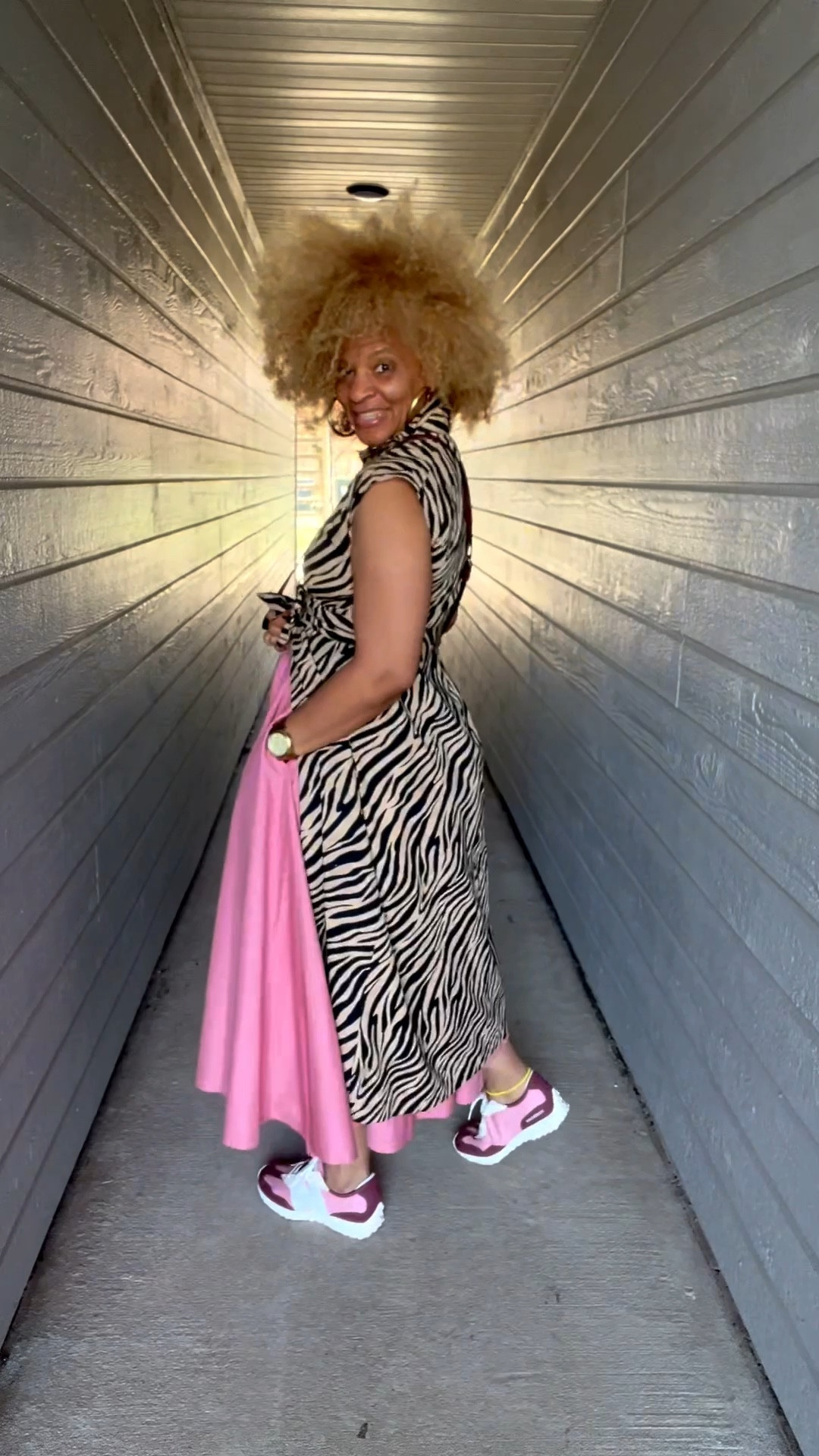 Just having fun with bold prints and playful colors on this sunny day! Feeling a bit fierce today where animal print meets a pop of pink. I'm just enjoying the sunshine! ☀️💖✨ 

#OOTD #SpringVibes #styleinspo #chicandcomfy #teachersofinstagram

Dress: @mango  
Skirt: @Jbrooksboutique
Sneakers: @newbalance  
Waller Bag: @Michael Kors US  
Rings: @hellobaabs (use code STORY20)