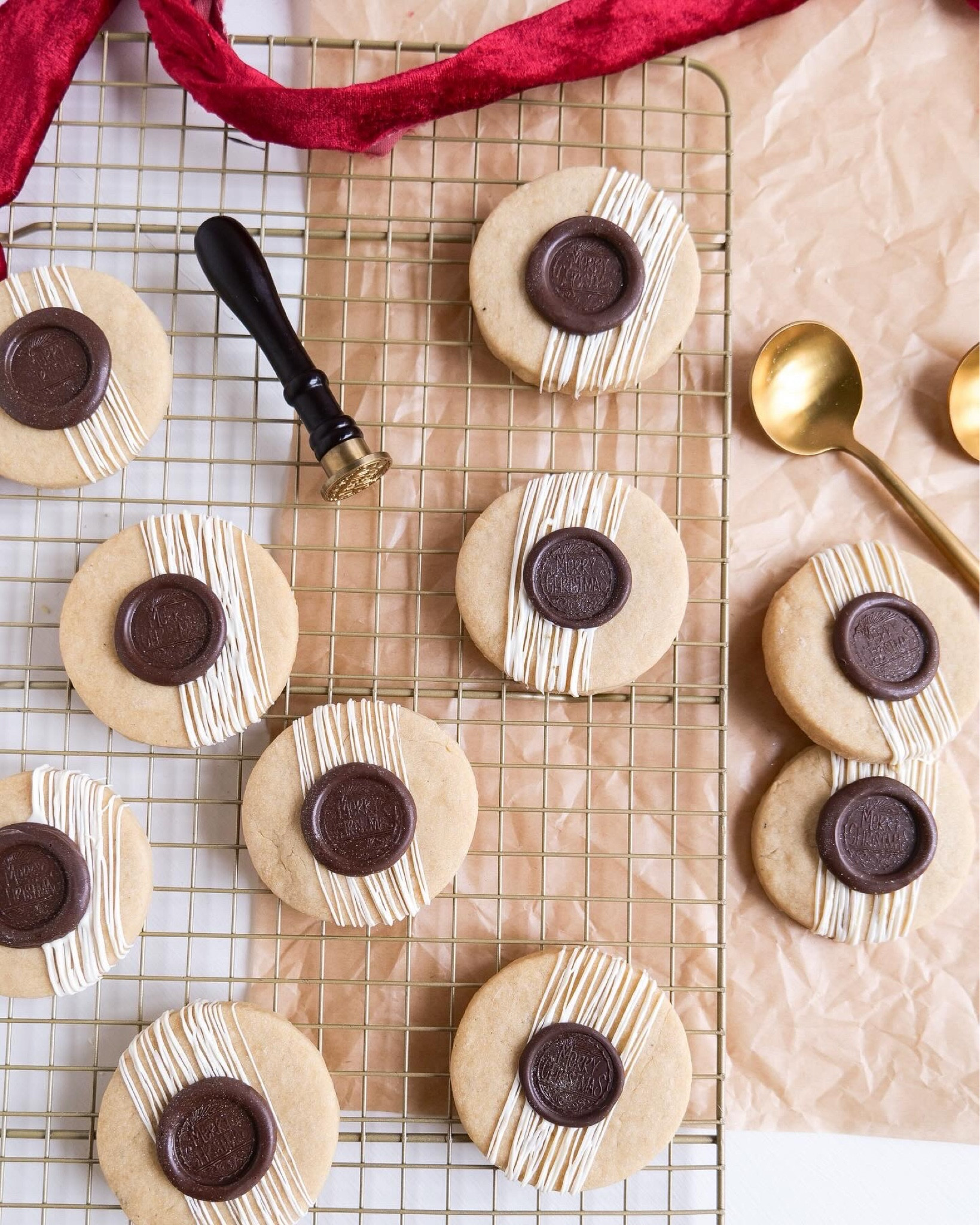 Imagine the irresistible aroma of butter melting slowly into a golden, nutty essence, filling your kitchen with a delicious smell and warmth that promises something truly special. This is the beginning of our journey to creating the ultimate brown butter shortbread cookies—a classic treat reinvented with a sophisticated twist. Each cookie, a masterpiece of simplicity, is made with care, transforming traditional shortbread into a decadent experience with its rich depth of flavor. To elevate this delight to a realm of elegance, we'll crown every cookie with a chocolate "wax" seal, reminiscent of an age when such a seal was a mark of distinction and quality. This whimsical touch not only adds visual intrigue but infuses each bite with a smooth chocolate finish. So, preheat your ovens and ready your parchment paper as we embark on a culinary adventure to bake these irresistible brown butter shortbread cookies.  They are a perfect blend of nostalgia and modern flair.

#LTKHoliday #LTKhome