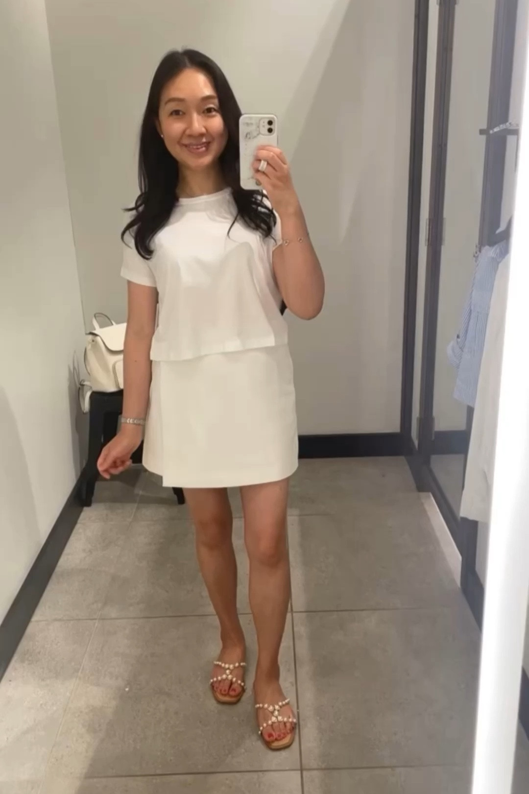 Lululemon Cates t-shirt in size 2 which is a relaxed fit.

White Skort from Amazon The Drop size XS.