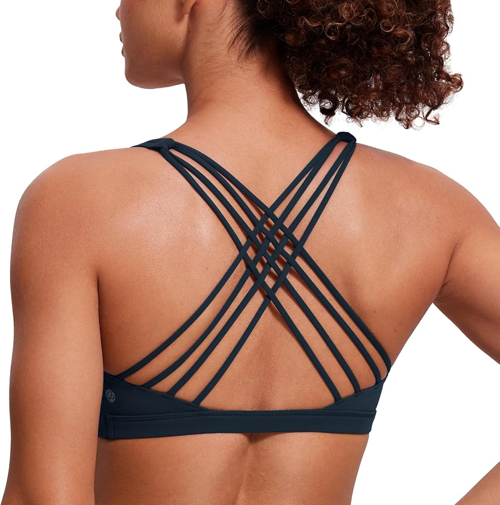 CRZ YOGA Strappy Sports Bras for Women - Criss Cross Back Wireless Padded Yoga Workout Cami Top | Amazon (US)