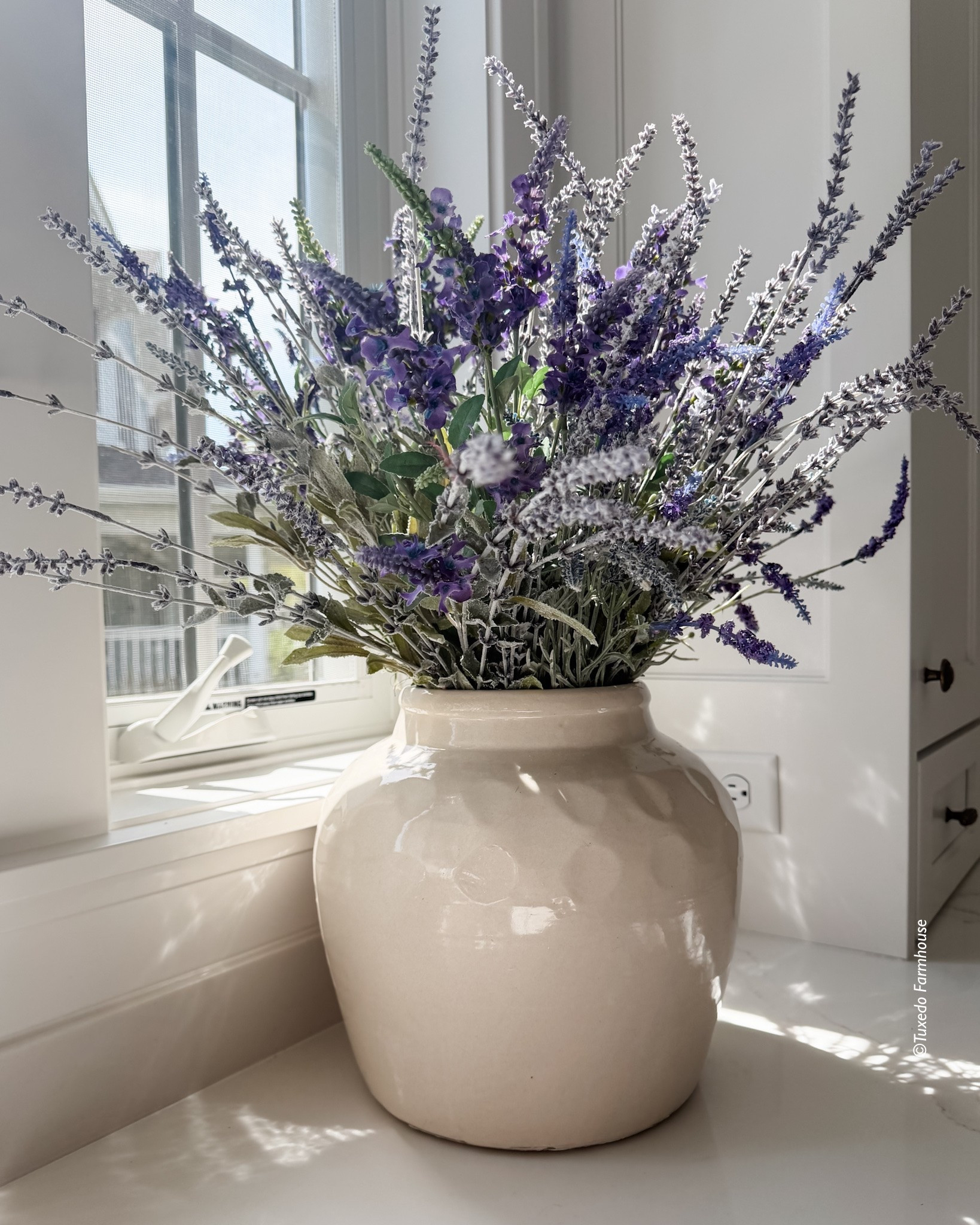 A pretty vase filled with faux lavender is a perfect mid-summer arrangement. I use a mix of 2-3 stems so there is variety.

#LTKSeasonal #LTKHome #LTKSaleAlert