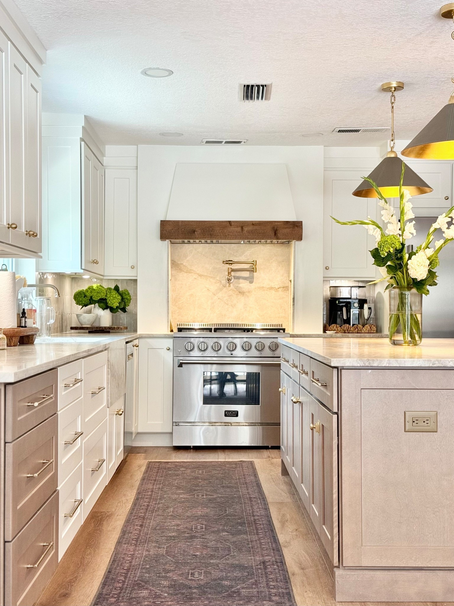 This kitchen is all about the little luxuries—like these stunning pendant lights that elevate the whole room. The exterior is wrapped in leather, while the inside features gold leaf iron for the dreamiest warm glow. Paired with a washable vintage-style runner (yes, washable!), it's form and function all the way🤍
⁠
💡 Tap to shop the pendants + runner
📌 Save this for your next kitchen refresh inspo!

#LTKGiftGuide #LTKStyleTip #LTKHome