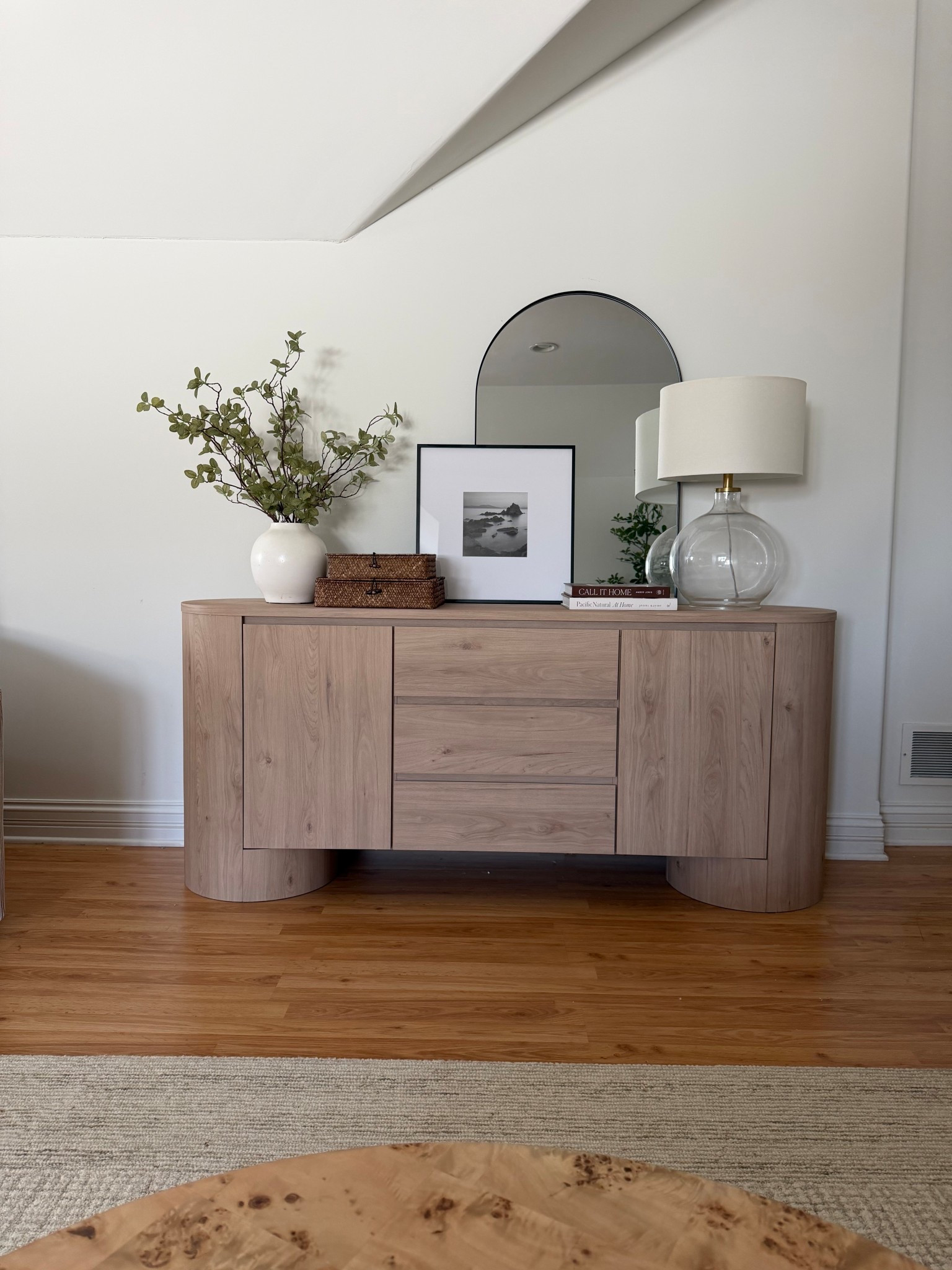 The curved oak sideboard from today’s reel 🤍
One of my most asked-about pieces — warm tone, soft edges, and makes the whole room feel custom without custom pricing.

Linked the sideboard + the simple styling pieces I keep on it.

#LTKHome