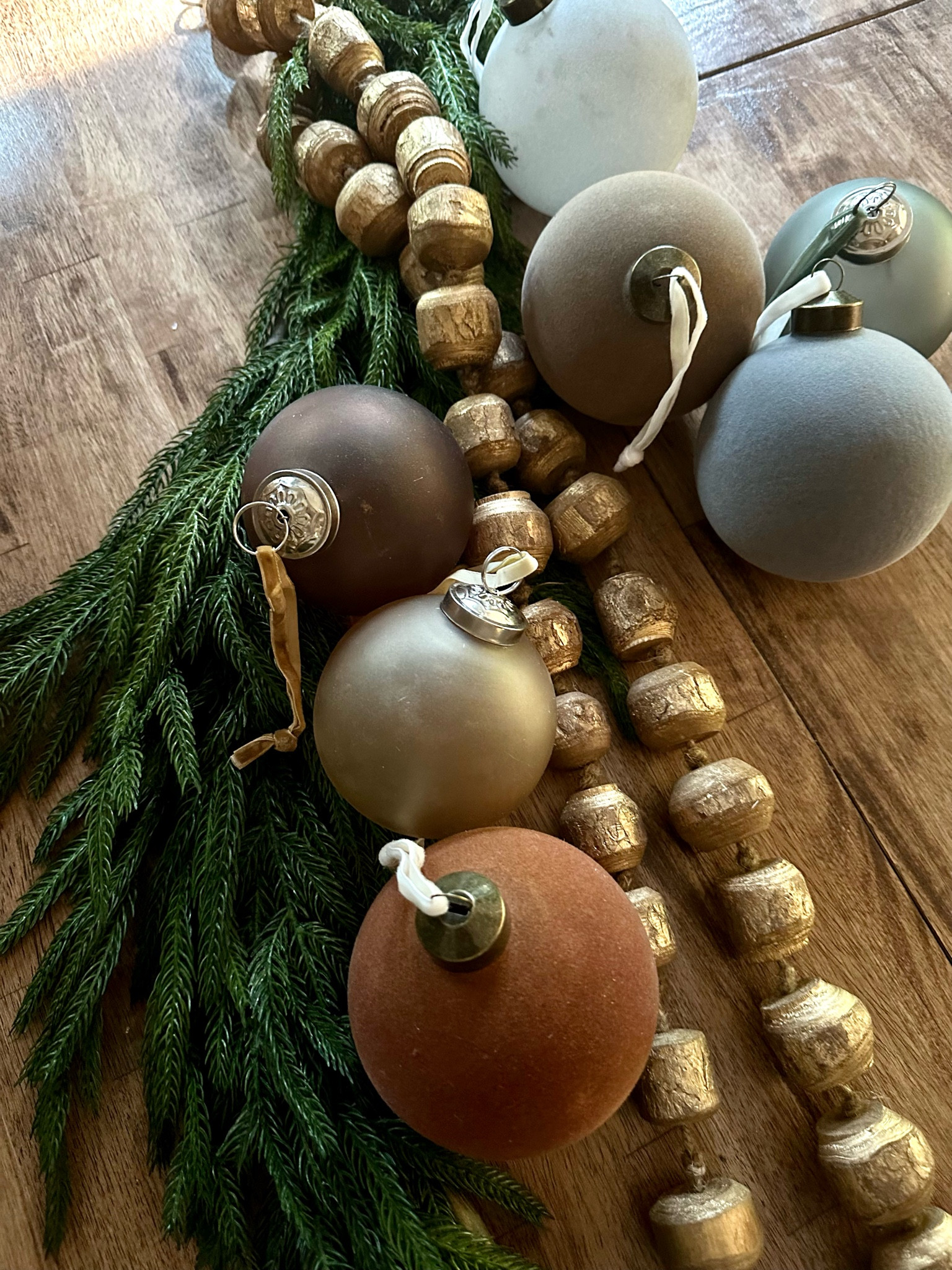 Beautiful velvet ornaments and wooden garland. 

#LTKfindsunder100 #LTKhome #LTKsalealert
