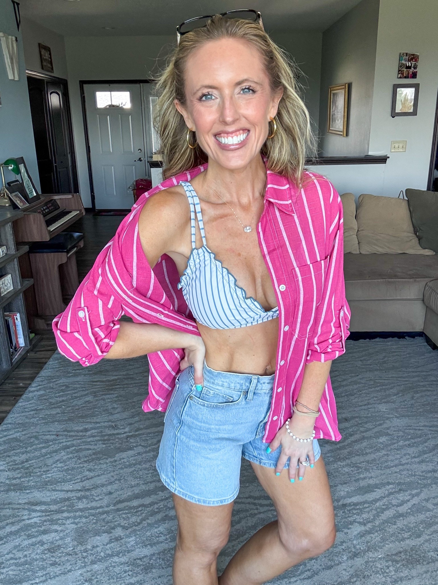 Loving this pink striped button down as a coverup! 🩷 This striped blue two piece swim has become a fave and can’t forget my absolute favorite 5” inseam denim shorts! Wearing a small in the top and swimsuit and xsmall in the shorts.

As an Amazon Influencer I earn commission on qualifying purchases.

Swim coverup top, viral denim shorts, mom life, blue striped bikini, summer styles, swimming pool outfit inspo, spring fashion 2026, resort wear, vacation looks

#LTKSwim #LTKootd #LTKMidsize