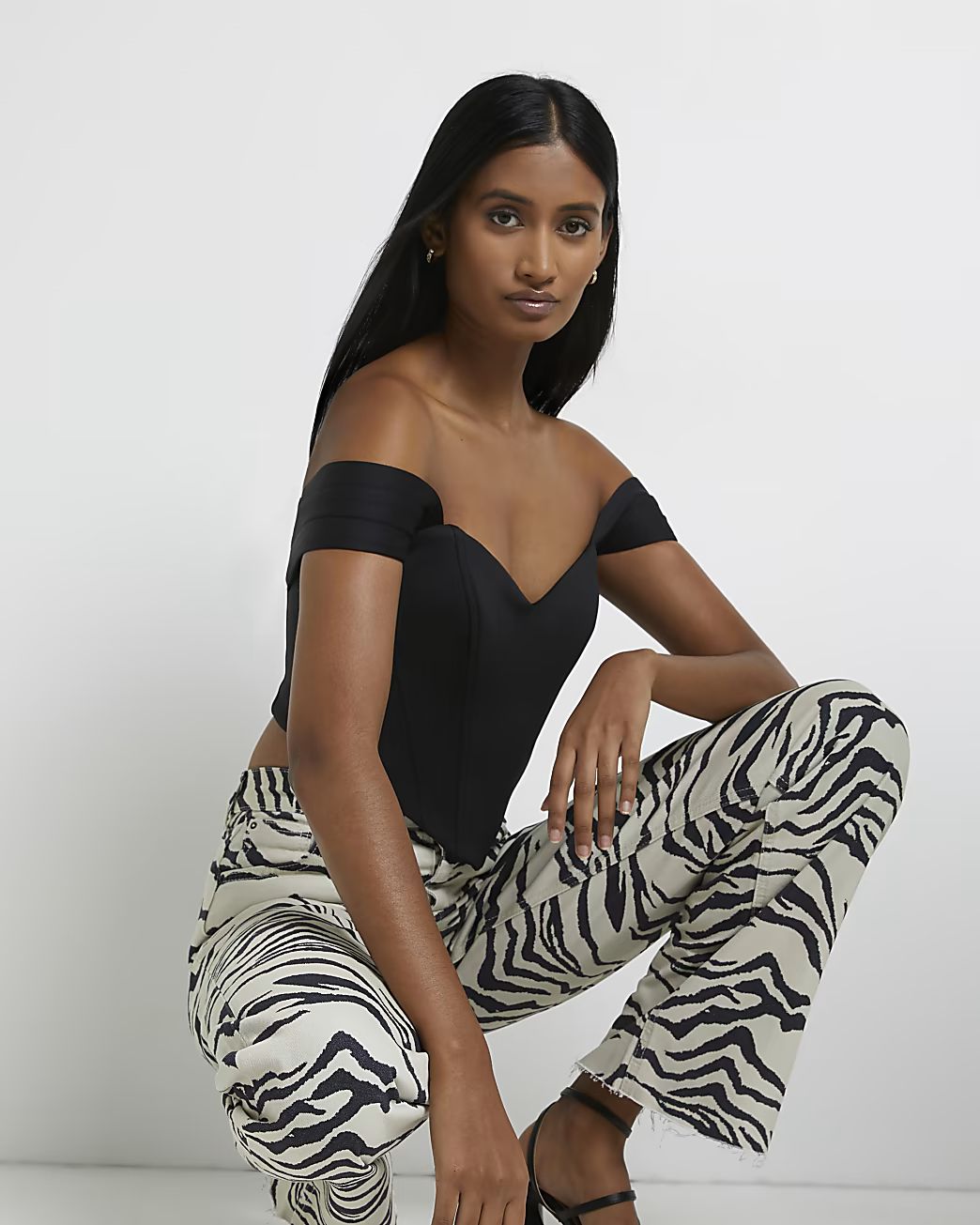 Ecru zebra print high waisted wide leg jeans | River Island (UK & IE)