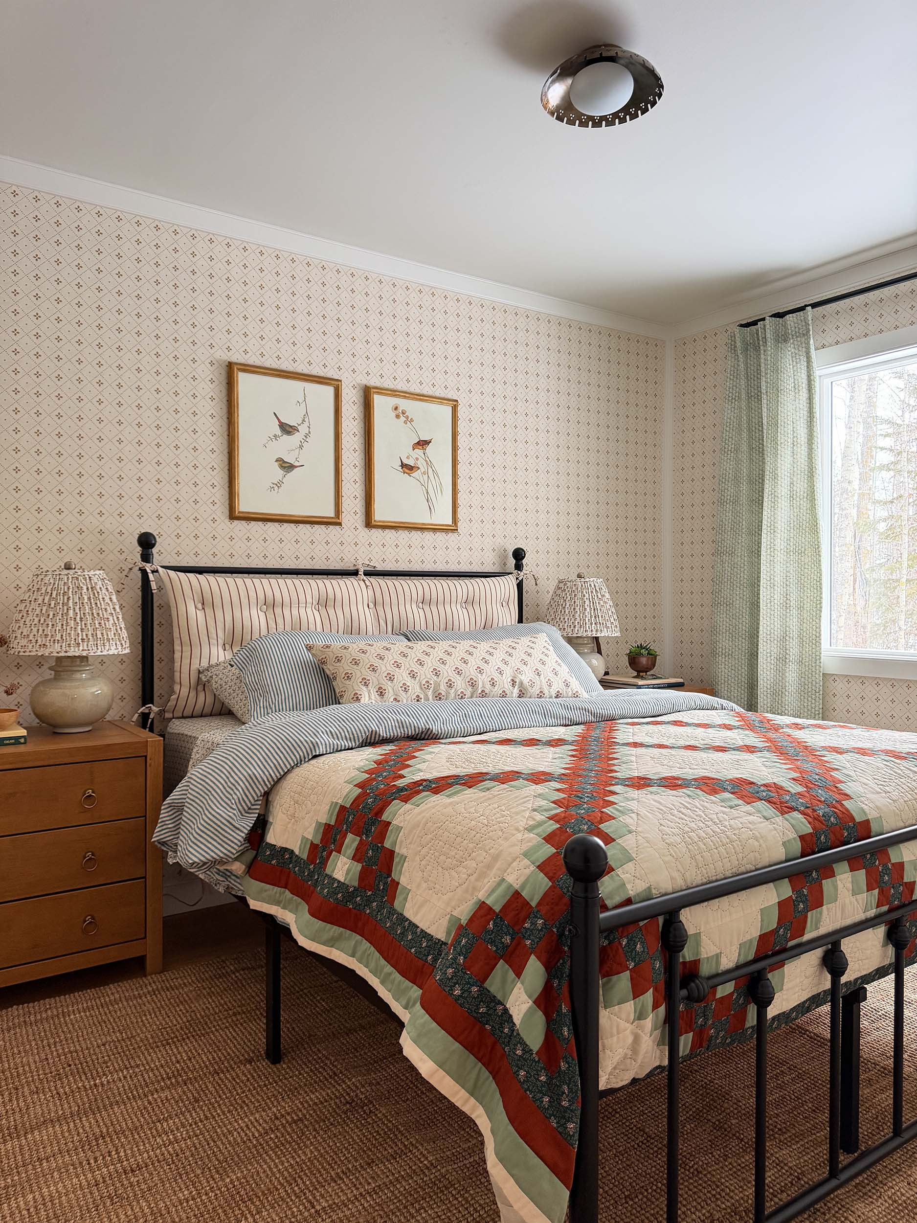 Cottage bedroom 

patterned bedding, wallpaper, brass lighting, iron bed, nightstands, hardware 

 #LTKHome