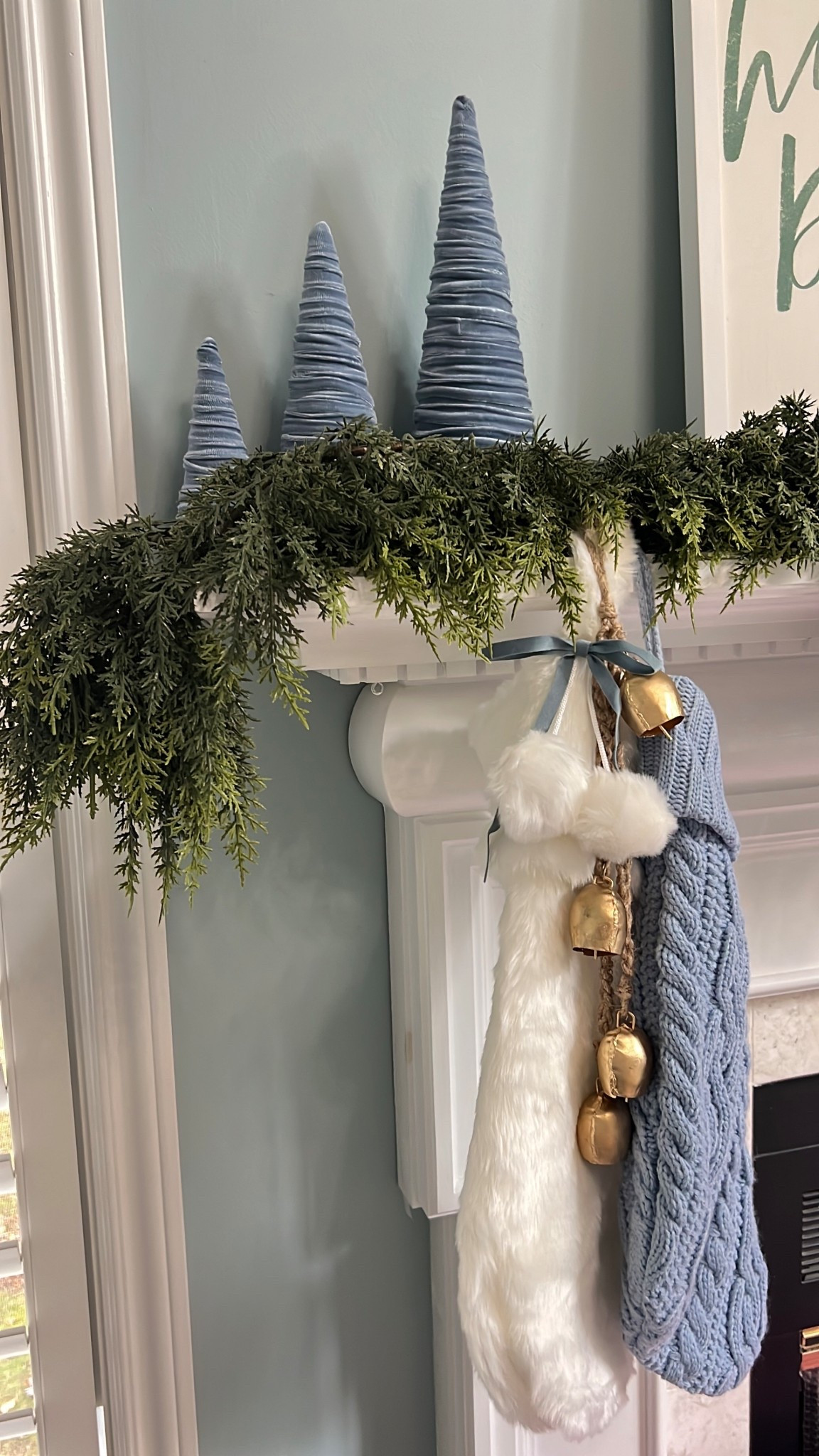 Proof that you don't need to be a professional stylist to make a mantel look cute. Just swapped a few things out with a faux mantel, velvet cone trees, chunky knit socks, and cowbell rings.

fireplace vibes, home refresh, winter decor, cozy christmas, living room goals, coastal house, holiday ornaments, home inspo

#LTKFindsUnder50 #LTKU #LTKSeasonal