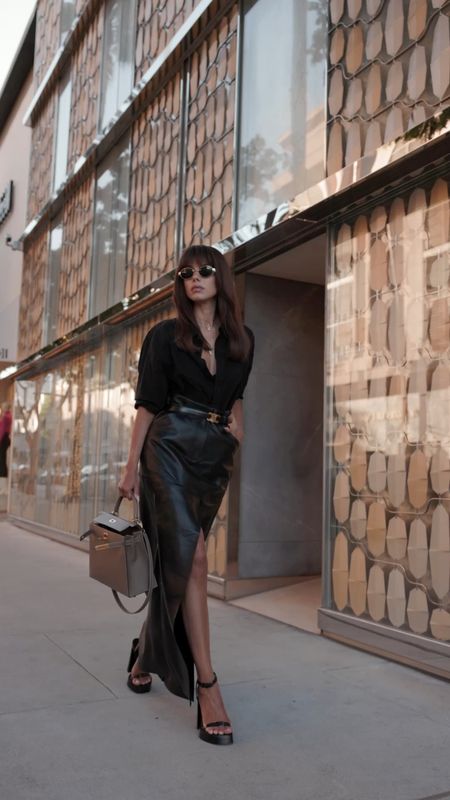 My favorite way to dress up an all-black look is by adding stylish accessories. 

Here, I paired an oversized black button down with a maxi black leather skirt, next, I added Celine belt and sunglasses and completed the look with Hermes Kelly bag. 

#LTKitbag #LTKstyletip #LTKshoecrush