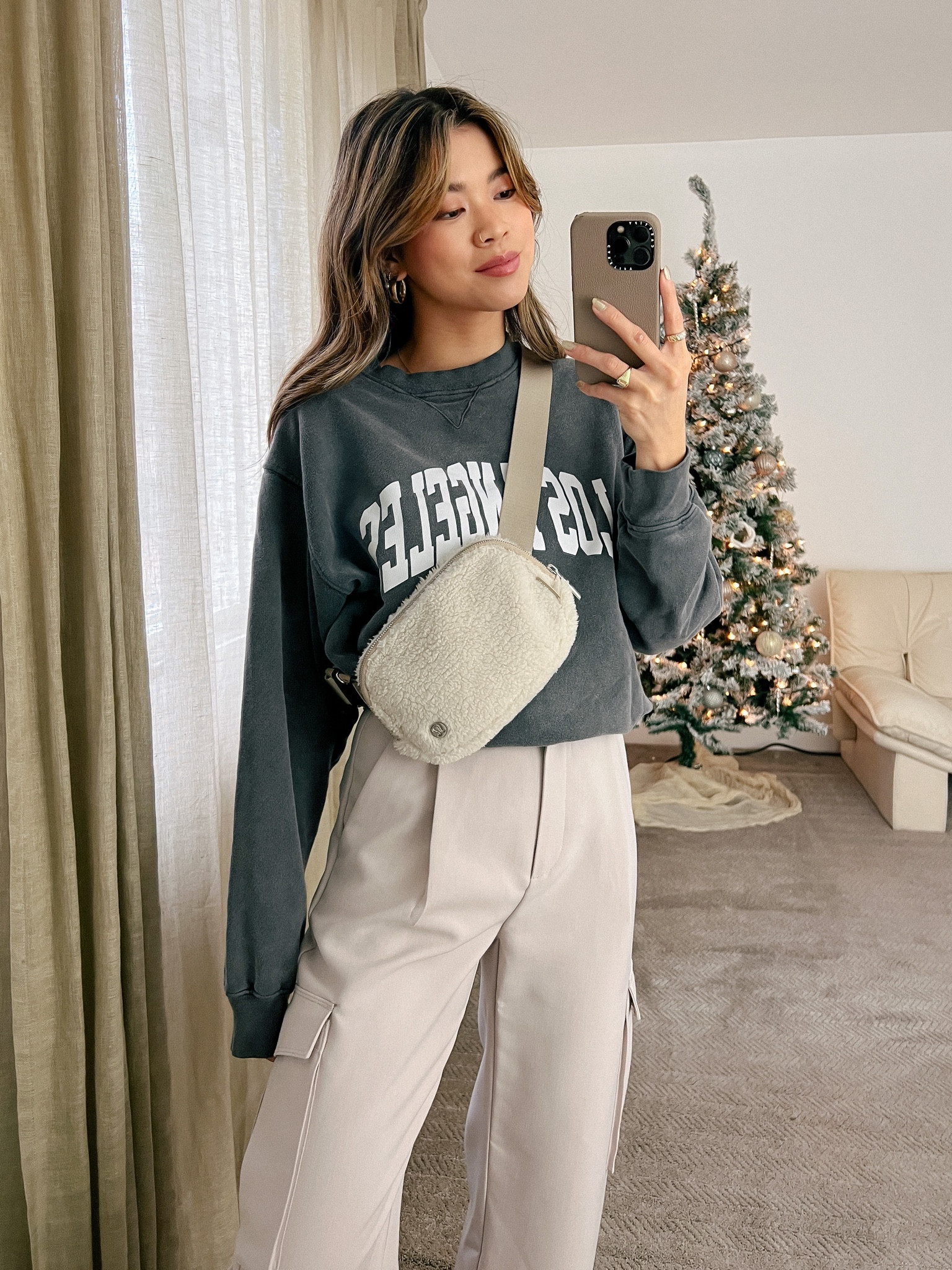 Revolve Anine Bing grey crewneck sweatshirt and Abercrombie beige cargo pants with Everlane white sneakers and a Lululemon belt bag!

Top: XXS/XS
Bottoms: 00/0
Shoes: 6

#winter
#winterfashion
#winterstyle
#winteroutfits
#holidayparty
#holidayoutfit
#holiday
#abercrombie
#revolve
#everlane
#lululemon

#LTKstyletip #LTKSeasonal #LTKHoliday