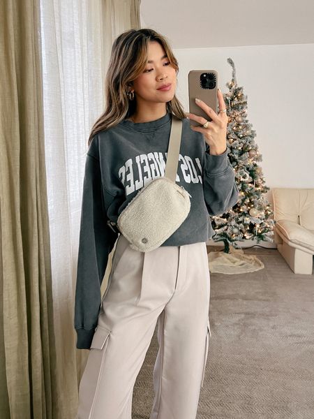 Revolve Anine Bing grey crewneck sweatshirt and Abercrombie beige cargo pants with Everlane white sneakers and a Lululemon belt bag!

Top: XXS/XS
Bottoms: 00/0
Shoes: 6

#winter
#winterfashion
#winterstyle
#winteroutfits
#holidayparty
#holidayoutfit
#holiday
#abercrombie
#revolve
#everlane
#lululemon

#LTKstyletip #LTKSeasonal #LTKHoliday