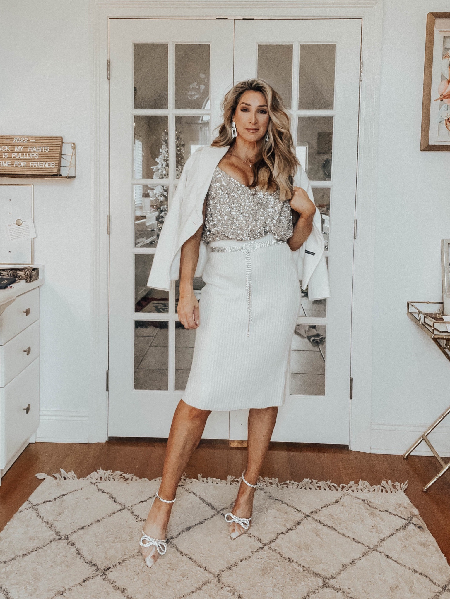 NYE outfit, holiday party, sequin top, bodysuit, ivory sweater skirt, clear bow heels, sequin belt

#LTKunder100 #LTKHoliday #LTKSeasonal