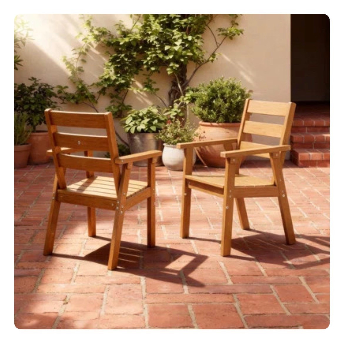 These wooden outdoor dining chairs bring such a warm, timeless feel to any patio or courtyard. The natural wood tone paired with the slatted design gives that classic, relaxed look that works perfectly with brick flooring, potted plants, and greenery. Easy to style for casual outdoor dining or a cozy morning coffee setup. 
