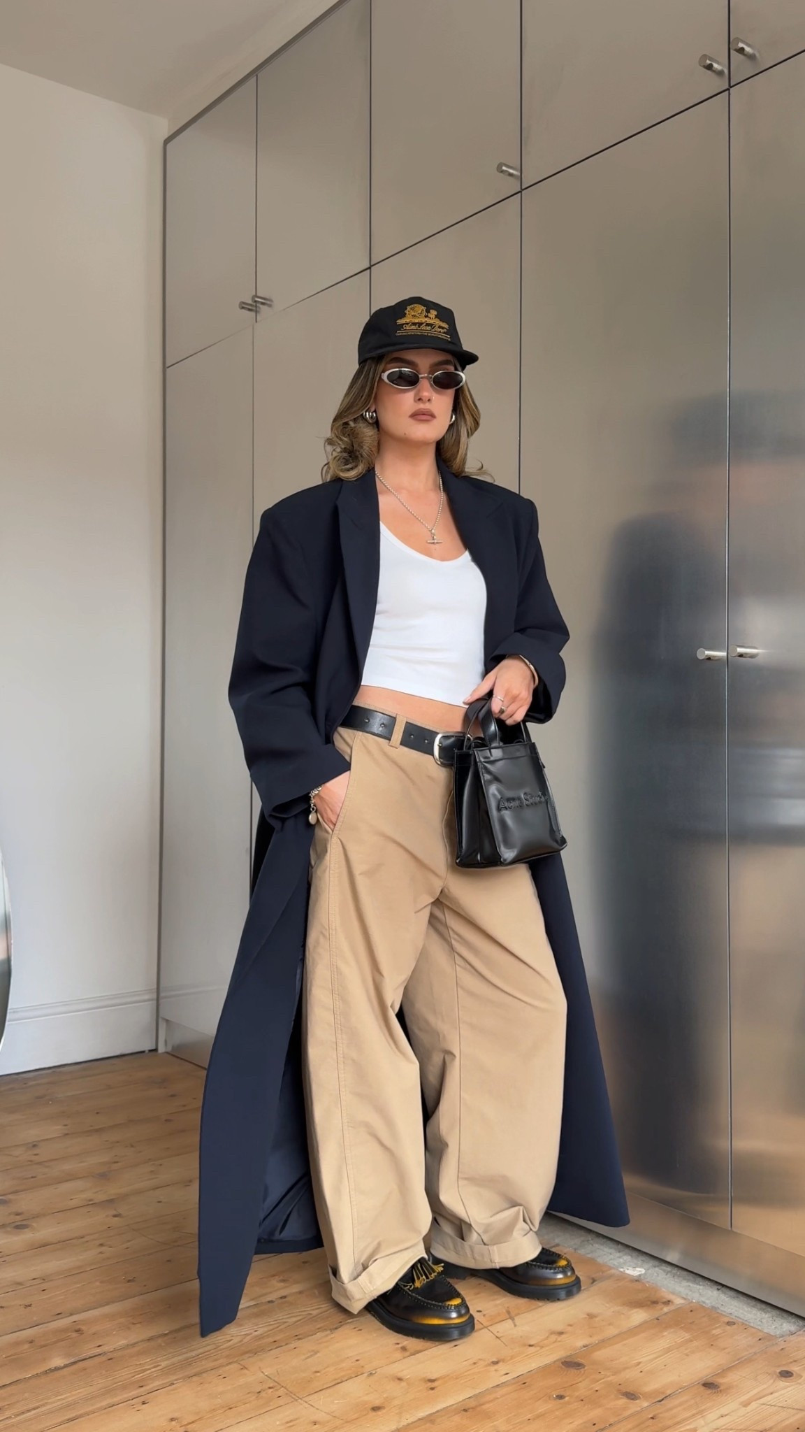 Tailored coat, barrel leg trousers, Uniqlo, dr martens, aime Leon dore, acne studios, black belt, black cap, white vest