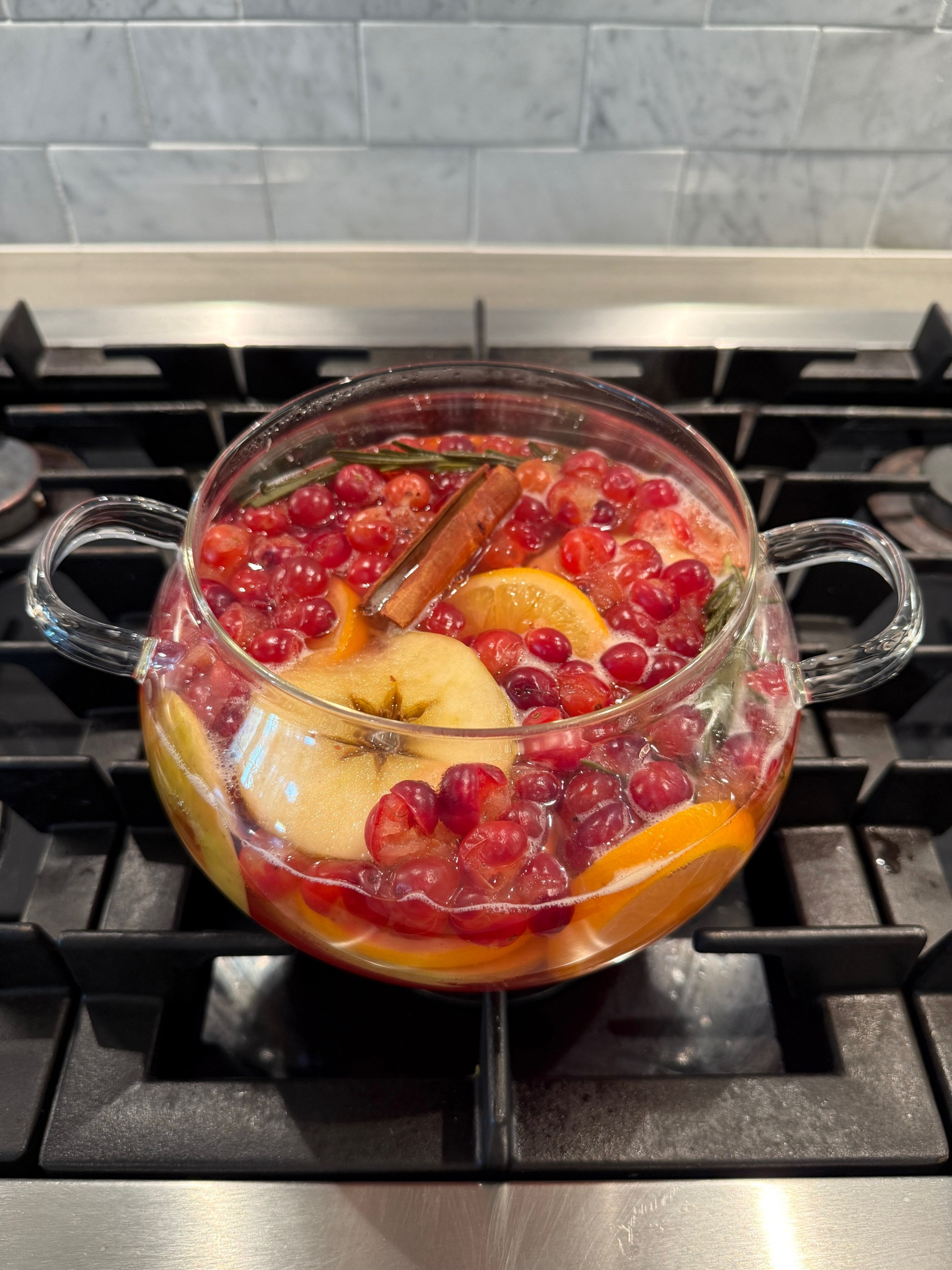 The best Christmas smell!! I used an apple, orange, cinnamon sticks, rosemary sprigs, and cranberries! Holiday simmer pott

#LTKHome #LTKHoliday #LTKSeasonal