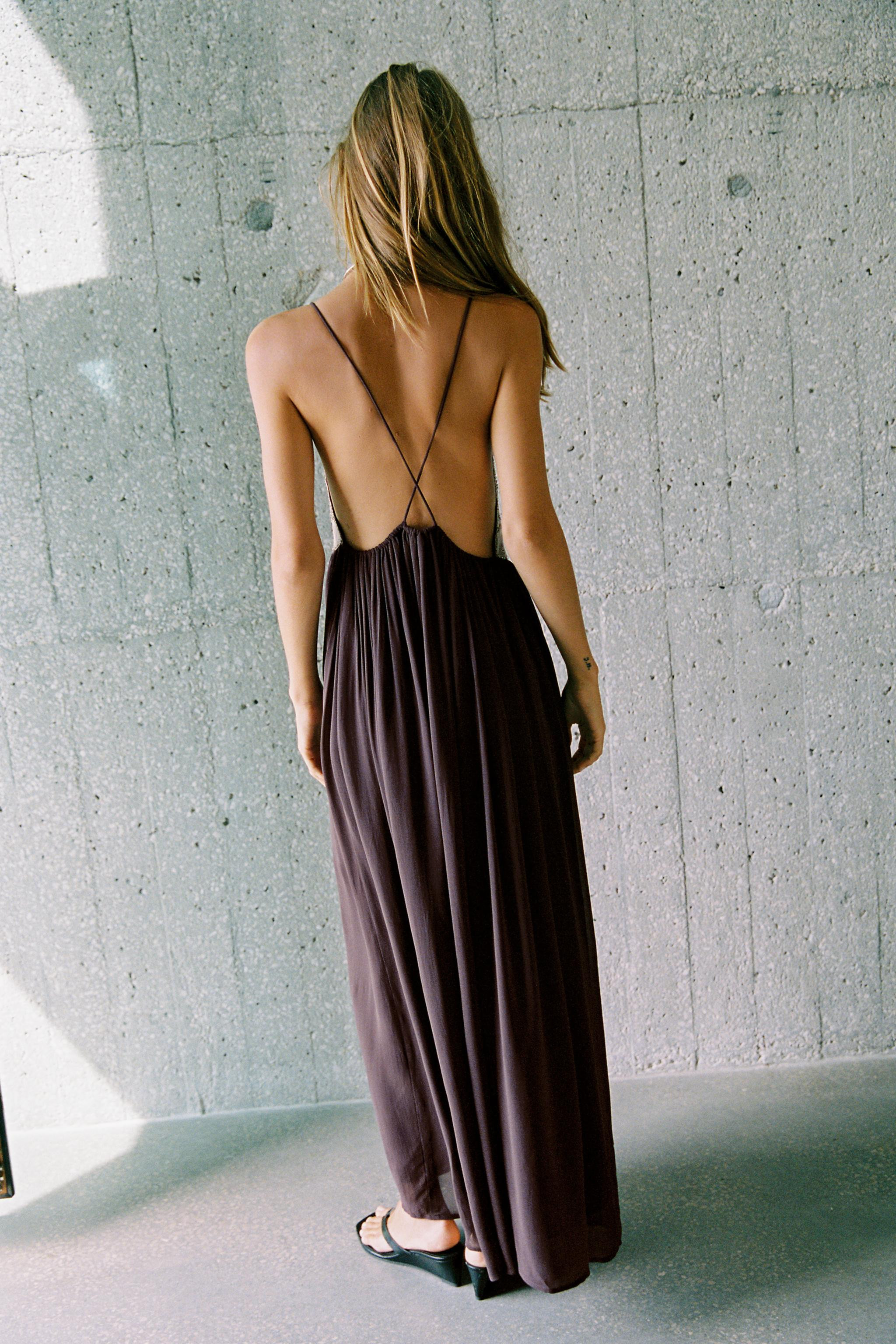 Model height: 177 cmLong V-neck dress featuring embroidery and bead detailing. Slim crossover str... | Zara UK