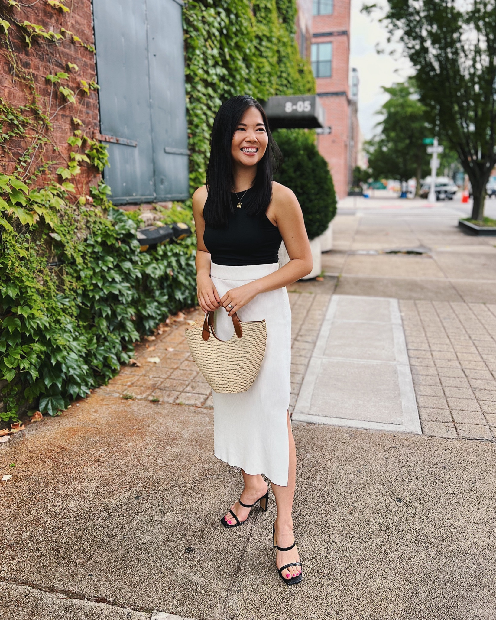 Black crop top (S)
Black top
Black seamless tank
Black tank
White skirt with leg slit
White pencil skirt
Brown top handle bag
Brown bag
Straw tote bag
Straw bag
Gold initial necklace
Gold necklace
Gold pendant
Black mules
Black heels
Black strappy heels
Smart casual outfit
Work outfit
Date night outfit
Neutral outfit
Minimalist outfit 
Amazon fashion
Amazon The Drop
Amazon finds#LTKxPrimeDay

#LTKworkwear #LTKsalealert