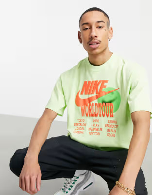 Nike World Tour Pack graphic oversized T-shirt in lime | ASOS | ASOS (Global)