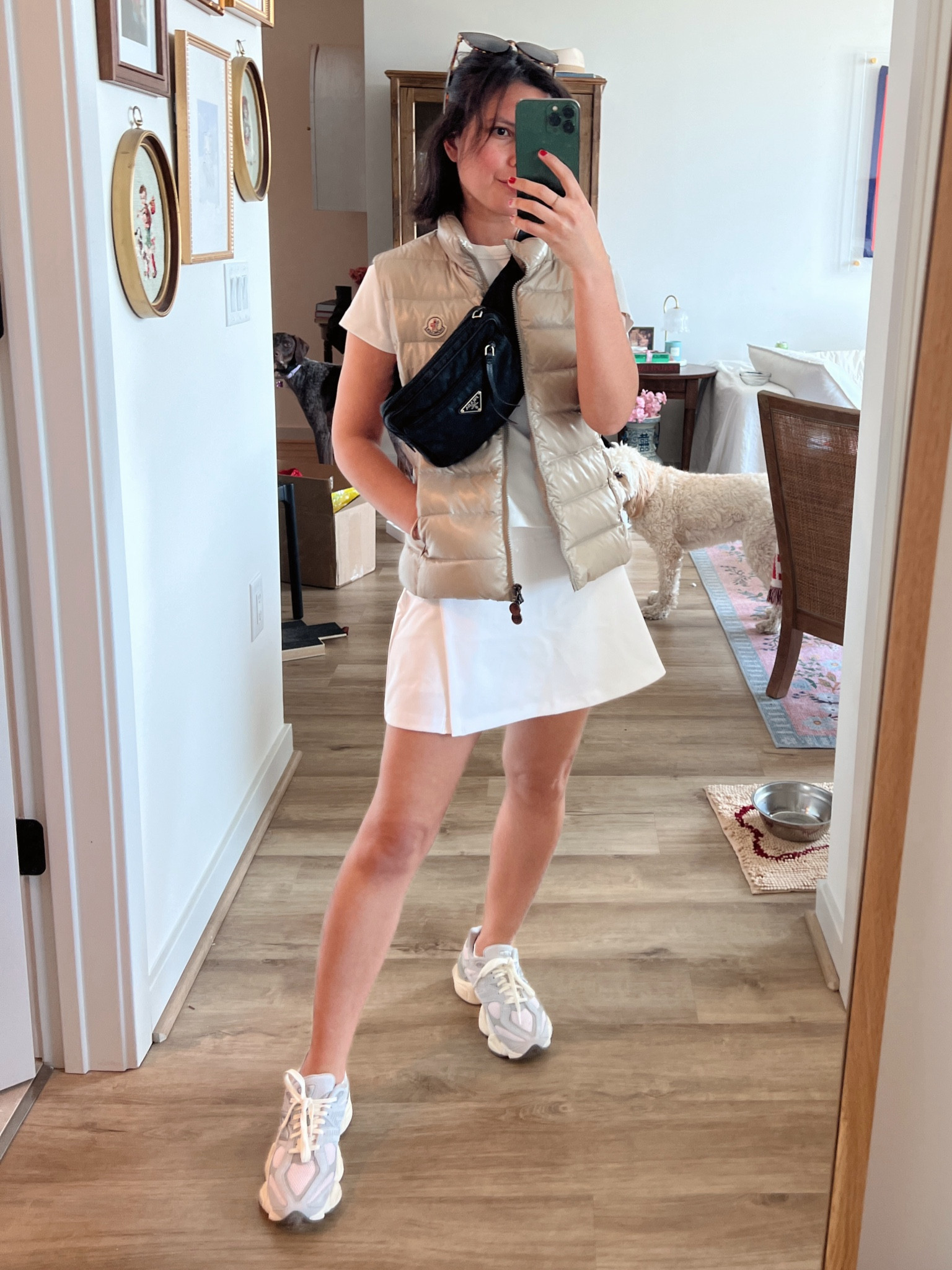 Spring errands, athleisure, Abercrombie skort, tennis skirt, new balance sneakers, new balance 9060, white tee, marine layer, puffer vest, 70 degree weather, belt bag, marine layer 

#LTKfindsunder100 #LTKfindsunder50 #LTKActive
