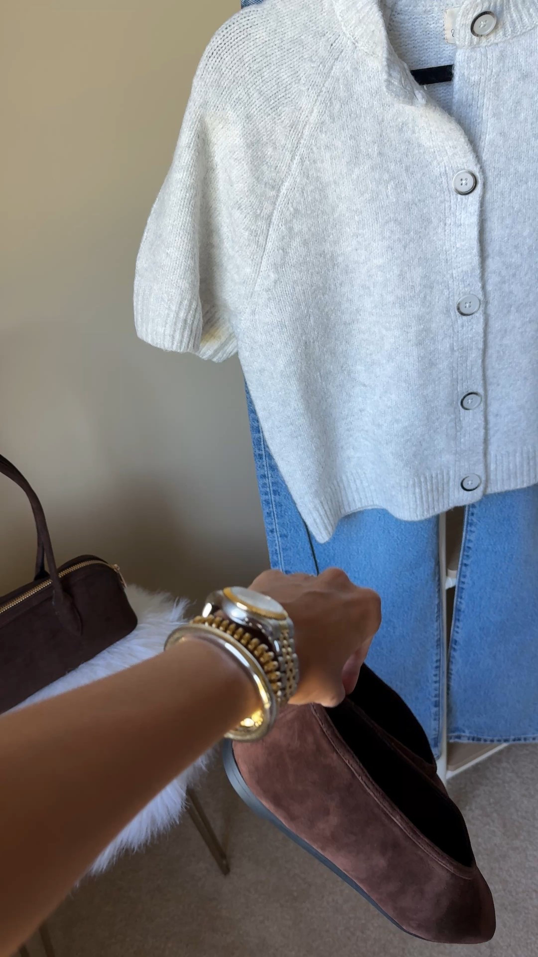 Easy outfit in between seasons. 
- Short sleeve sweater cardigan can be worn alone, layered over a t-shirt, or worn open over a tank top. This exact knit top is soft and feels comfortable on the skin; $25  I sized up for a looser fit. 
- My jeans are a favorite Levi’s style that are currently 30% off. Loose straight leg. I sized up. 
- Trending bag style in a look for less option; $30. 
- Beautiful chocolate brown flats!  Nice suede material and flexible sole. True to size. 
- Mixed metals bracelet stack. 


#LTKShoeCrush #LTKStyleTip #LTKOver40